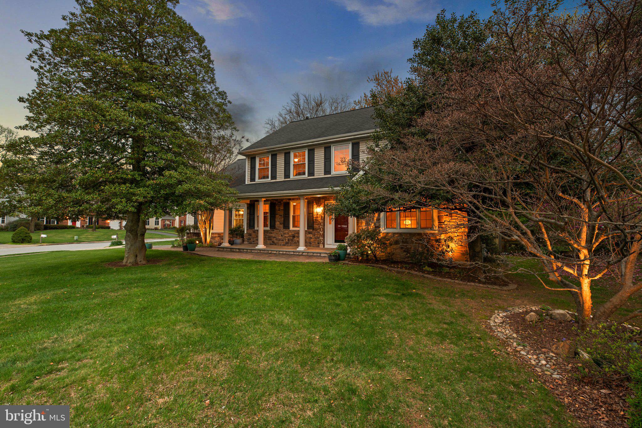 Beautiful stone-accented Colonial featuring 2,316 square feet, 4 bedrooms, 2 full baths, 1 half bath, and a 2-car garage on a cul-de-sac in a welcoming neighborhood in highly sought-after Ellicott City. A charming brick walkway leads to the spacious front porch with elegant columns, surrounded by lush landscaping. Step inside to an immaculate interior where hardwood floors extend throughout the traditional main level, including a two-story foyer, a sun-drenched formal living room, and a formal dining room with chair rail detail.  The gourmet kitchen boasts a peninsula breakfast bar, upgraded counters, a 5-burner stove, select stainless steel and ENERGY STAR® appliances, a pantry, a stylish tile backsplash, and a sunny breakfast room. The adjoining family room features a wood-burning fireplace with tile surround and access to the backyard. A powder room and main-level laundry add everyday convenience.

Upstairs, find four generously sized bedrooms with plush carpeting and two full baths. The spacious owner’s suite offers cathedral ceilings, custom stained-glass window inserts, a walk-in closet with built-in organizers, and a luxurious en suite bath complete with a soaking tub and an oversized double vanity. One of the secondary bedrooms includes dual closets for added storage. The lower level is ready for storage or your personal touch—complete with a natural gas valve for an easy future fireplace installation.

Unwind with a book on the Trex® deck under the maintenance-free pergola or prepare dinner on a grill fueled by the home’s natural gas system. The fenced backyard is beautifully landscaped for privacy, with a meandering brick walkway and gardens featuring over 100 hostas and other perennials. LED landscape lighting (120v) highlights both the front and backyards. Mature trees provide shade and tranquility, including a 100-year-old holly tree—a living remnant of the property’s farmhouse roots. Wildlife is abundant, adding to the peaceful atmosphere. Enjoy a prime location just around the corner from Giant Food and a popular Chinese carryout, with a path across the street that leads directly to Rockburn Park and Rockburn Elementary School. This home offers easy access to Routes 100 and 95, is just five minutes from Timbers at Troy Golf Course, and is less than 15 minutes from BWI Airport and Amtrak.
