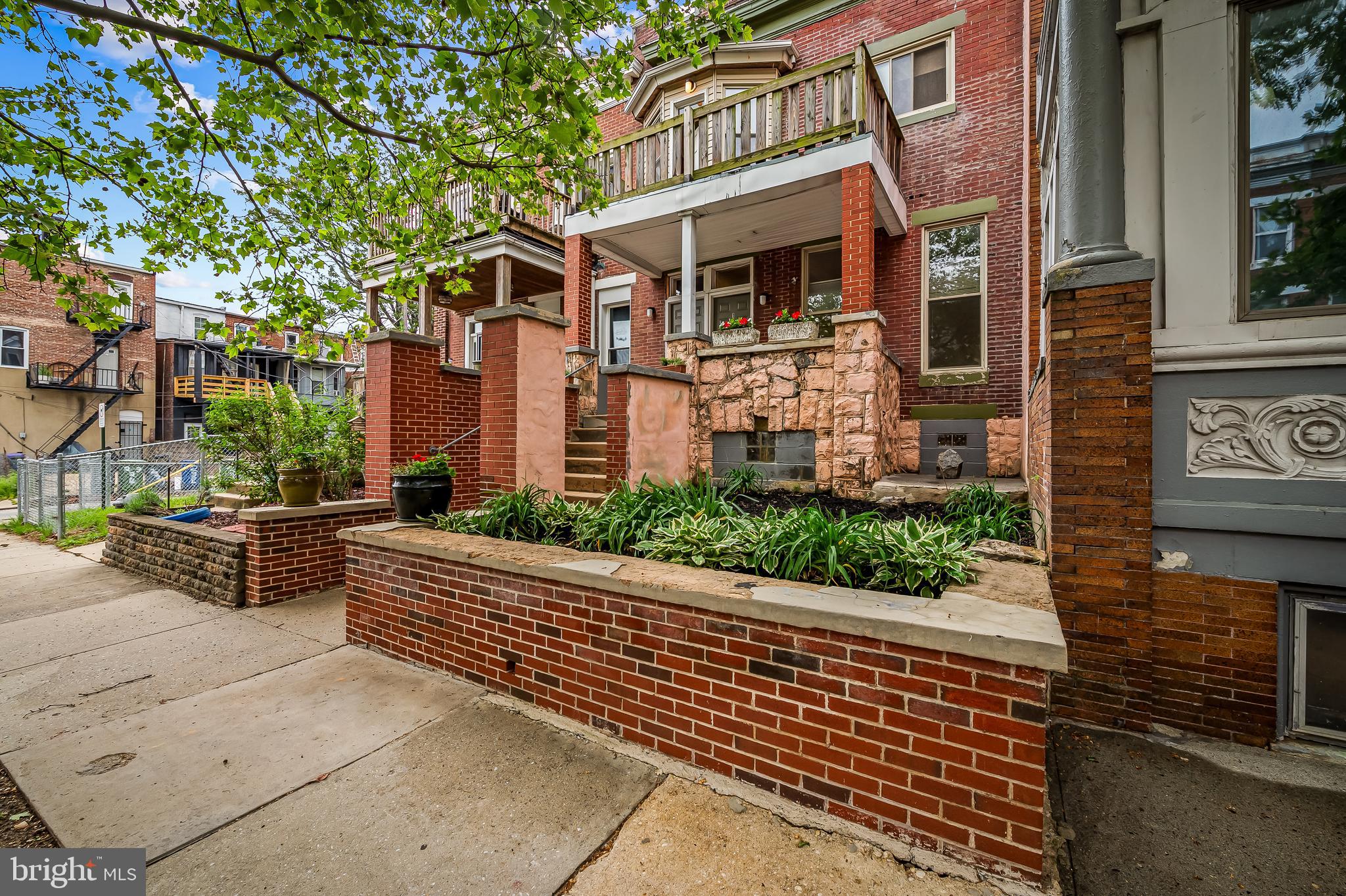 Customize a home in Historic Reservoir Hill – with Built-In Income Potential from a second unit for a resident owner. This is a rare opportunity to create your ideal home and renovate for likely instant equity in one of Baltimore’s most vibrant, evolving historic neighborhoods. Located just one block from Druid Hill Park and within walking distance of the highly anticipated Reservoir Square development—including proposed shops, restaurants, and a grocery store—this 2,730 sq. ft. 2-unit property could be renovated as-is with two single-level units but has also been redesigned by seller for transformation and the architectural floor plans will be provided to Buyers with familiar contractor contact info. as a courtesy. The proposed renovation redesigns the building as a spacious private-entrance 3-bedroom, 2.5-bathroom owner’s residence with private porch and 2nd fl. balcony off of the primary bedroom with a rear-entry 1-bedroom + office, 1.5-bath apartment and parking space—perfect for generating rental income, housing an au pair or in-law, or establishing a professional office suite. The apartment projected income could offset  $200-250K of your mortgage post-renovation. Compare that to  $400K sale price for nearby Reservoir Square new construction similar in size to just the larger of the two designed units. Or maintain the existing structure as two 2-bedroom single-level units. Key Features: balcony, porch, and design includes off-street rear parking; Full basement with updated utility plans to maximize living space; Side staircase and shared entry pad offering functional dual access; architectural floor plans, contractor and masonry bids, engineer report and pest inspector info. and transferable warranty included; Renovation-ready; Eligible for tax credit programs; Perfect candidate for a FHA 203(k) renovation loan—and we can connect you to lenders actively seeking this type of project. This property is ready for immediate transformation. One of the Owners, a resident owner in Reservoir Hill, was about to begin construction but, given the rapid transformation of Reservoir Hill, decided to instead list the house for sale to allow the Buyer to customize their design. Whether you want to maintain the existing floor plan or follow the thoughtfully designed plans and tailor finishes like tile, cabinetry, and fixtures to your taste, this is your chance to shape a special custom home. Bring your vision, take advantage of all the groundwork already laid, and build something beautiful—just steps from Druid Hill Park.