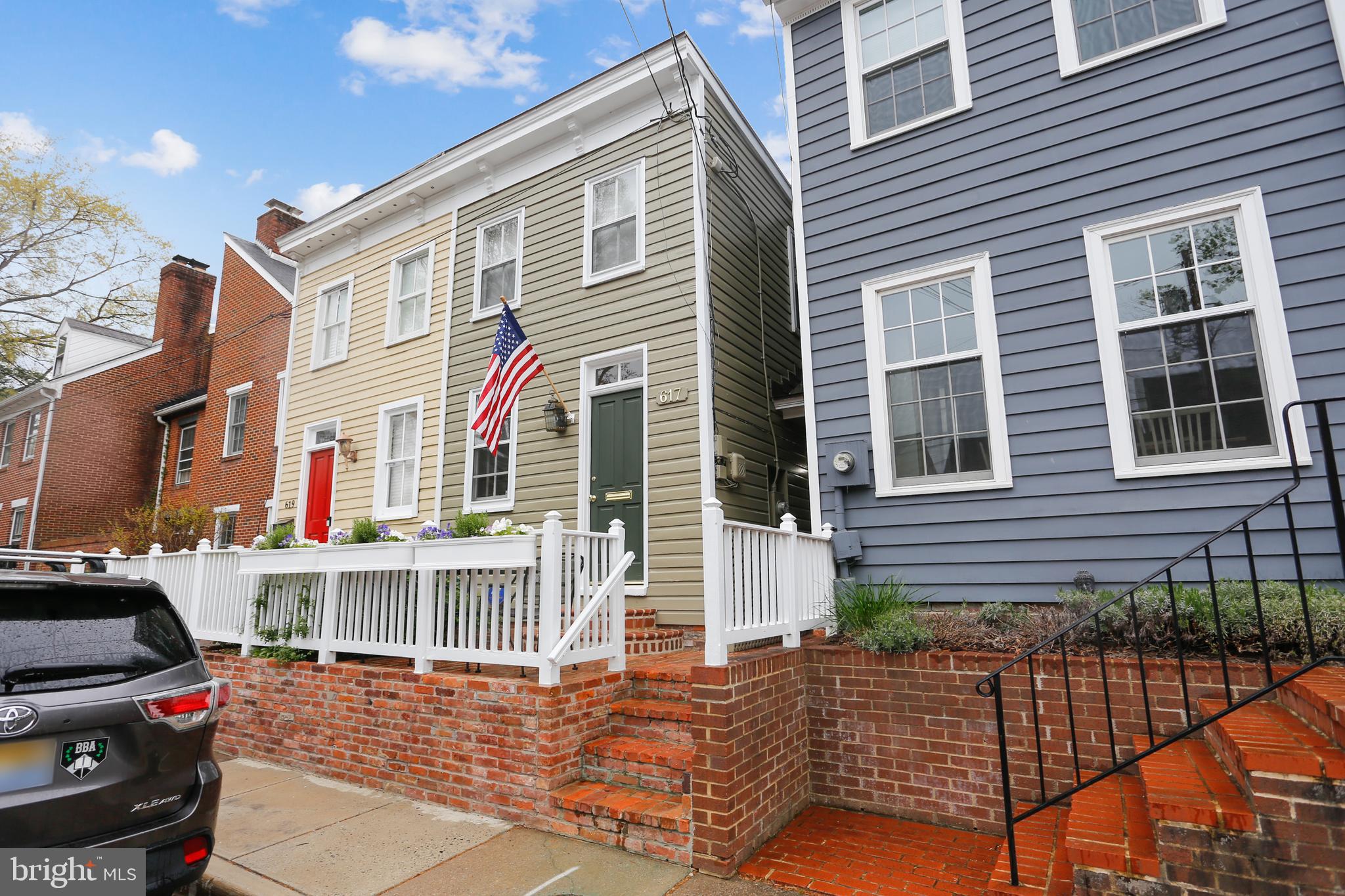 Located in historic Old Town Alexandria's sought after Southeast Quadrant this gracious home was originally
built around 1800. A high quality renovation has brought the property up to today's standards.
Reclaimed heart of pine floors have been installed on both the main and upper levels.  The focal point of the spacious living room is the gas log fireplace flanked by two sets of French doors leading to the charming 
rear terrace.  The garage at the back of the terrace was architecturally designed to resemble a quaint cottage.  The upper level of the garage features a kitchenette area and full bathroom , perfect for an office
or additional bedroom.  The kitchen has Viking appliances, a wine refrigerator and custom cabinetry made in Kentucky. The dining room features a large built-in for extra storage.  The primary bedroom with en-suite  bathroom and two sets of French doors overlooks the backyard terrace. The secondary bedroom also features an en-suite bathroom with jacuzzi tub.  The upper level  has a hallway space ideal for a desk.
A skylight brightens the stairwell to the upper level. Laundry facilities are also on the bedroom level.  On the lower level you will find the recreation room,cedar lined closet and another full bathroom.  This pristine property offers delightful entertaining spaces inside and out!   The correct size of the living room is 14' 10" x 20'  floor plan being corrected.