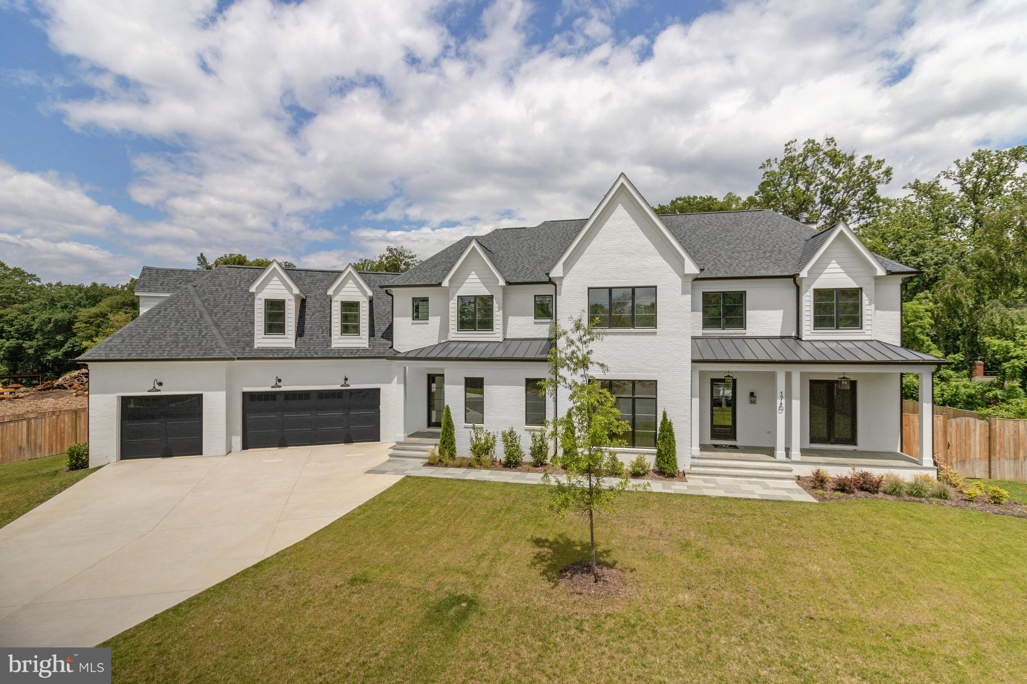 Welcome to 1740 Atoga Ave, a thoughtfully designed and detail-rich new build by CR Custom Homes, located on a private cul-de-sac in McLean. Perfectly situated on a 0.36-acre lot, this 7-bedroom, 7 full and 2 half-bathroom home offers 9,214 square feet of living space across three levels. The exterior features a flagstone front porch, architectural shingles, professional landscaping with irrigation, and a three-car garage with smart Clopay doors and battery backup openers. Inside, you’ll find rich 4" white oak hardwood flooring with exquisite details like the herringbone foyer, solid wood doors, designer lighting and upgraded trim throughout, dual staircases to all three levels and an elevator shaft, currently closets, ready for future installation.
Designed for modern family living and effortless entertaining, the main level boasts a formal dining room, an inviting study/home office with fireplace and custom millwork built-ins, and a gourmet chef’s kitchen with frameless cabinetry, Quartz countertops and backsplash, premium JennAir appliances, oversized island with breakfast bar and a large walk-in pantry with space for a secondary prep kitchen. The open family room with gas fireplace features a custom millwork accent wall, echoing the formal dining room, and flows seamlessly to a screened-in porch with a third fireplace, offering year-round indoor-outdoor living with built-in heaters and ceiling fan. A main-level bedroom with en-suite bath, powder room, and mudroom with built-ins, add both function and flexibility.
Upstairs, the luxurious primary suite features dual walk-in closets, a sunlit dressing area, and a spa-like primary bath with heated floors, soaking tub, dual vanity, and separate oversized shower. Four additional bedrooms each have en-suite bathrooms and ample closets. A large laundry room with built-ins and a central loft space ideal for homework, reading, or relaxing, complete the upper level. The expansive lower level includes a large rec room with wet bar, exercise room, bedroom with full bath, multiple storage rooms, and a spacious flex room with 10’ ceilings - perfect for a golf simulator, home theater, or wine cellar!
Built with comfort and energy efficiency in mind, the home includes three multi-zone high-efficiency HVAC systems with Nest thermostats, spray foam insulation, energy-efficient windows, LED recessed lighting, and Cat 6 wiring throughout. Located just minutes from top-rated public and private schools, parks, commuter routes, and all the amenities McLean has to offer, this home perfectly blends elegance, comfort, and convenience.