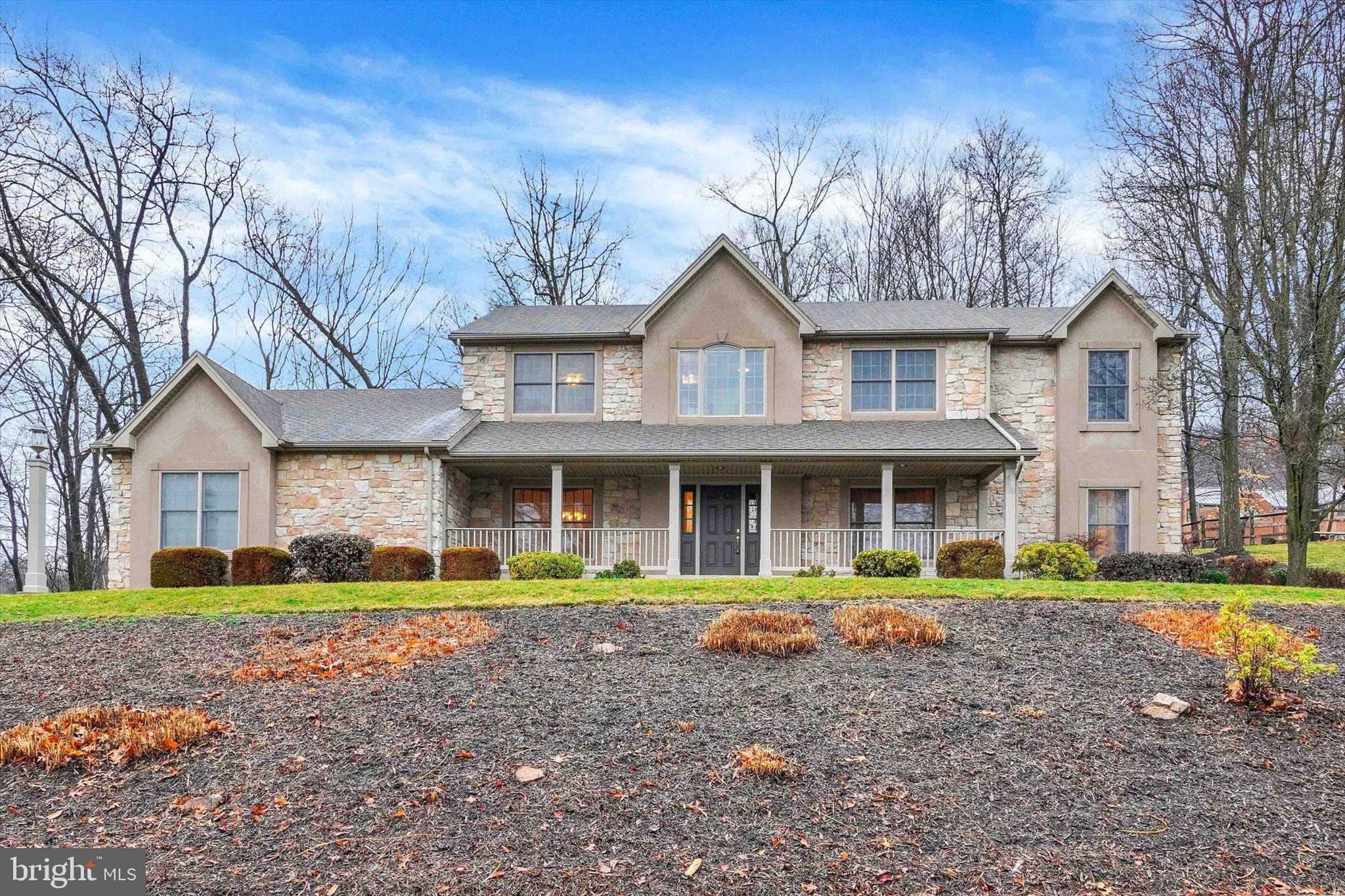 Welcome to this stunning 5 Bedroom home nestled in the desirable Mountaindale community! Totaling over 3,390 square feet of finished living space, this home boasts amazing features and thoughtful details throughout. Step into the grand foyer with hardwood floors and vaulted ceilings which sets the tone for the elegance that awaits. The French door leads you into the living room with carpet, crown molding and window treatments, this could also serve as a wonderful office space. Entertain guests in the formal dining room complete with carpet and crown molding. The eat-in kitchen features hardwood floors, vaulted ceilings in dining area, tile backsplash, convenient bar area, cambria quartz countertops, stainless steel appliances, double ovens and outdoor access to the patio. The kitchen is open to the cozy family room adorned with hardwood floors, window treatments and a stone gas fireplace, this is a great location to relax and enjoy the view from all the windows that provide lots of natural light. Main level bedroom provides convenience with carpet, ceiling fan, window treatments, walk in closet and an attached full bath. Updated Main level laundry with tile floors, utility sink, built in cabinets and a coat bench. Venture upstairs to discover four generously sized bedrooms. Primary bedroom offers a spacious tranquil retreat with carpet, window treatments, ceiling fan, large walk-in closet and an updated full spa-like bathroom with tile floors, double vanity, soaking tub and luxurious oversized tiled shower. A convenient Jack and Jill bedroom/bathroom set up. An unfinished basement provides plenty of storage space and offers large built in shelves for organizing. Lovely, enclosed sunroom features a ceiling fan and leads out to the patio overlooking the partially fenced backyard with beautiful wooded views. Oversized Three car garage and driveway offers a nice turn around area. Some rooms offer new carpet, Newer garage doors in 2017. Master bath remodel in 2019. Newer water heater in 2019. Newer UV light in 2023. Conveniently located to shopping, dining, entertainment and highways. Home has been pre-inspected. Truly, a joy to own!