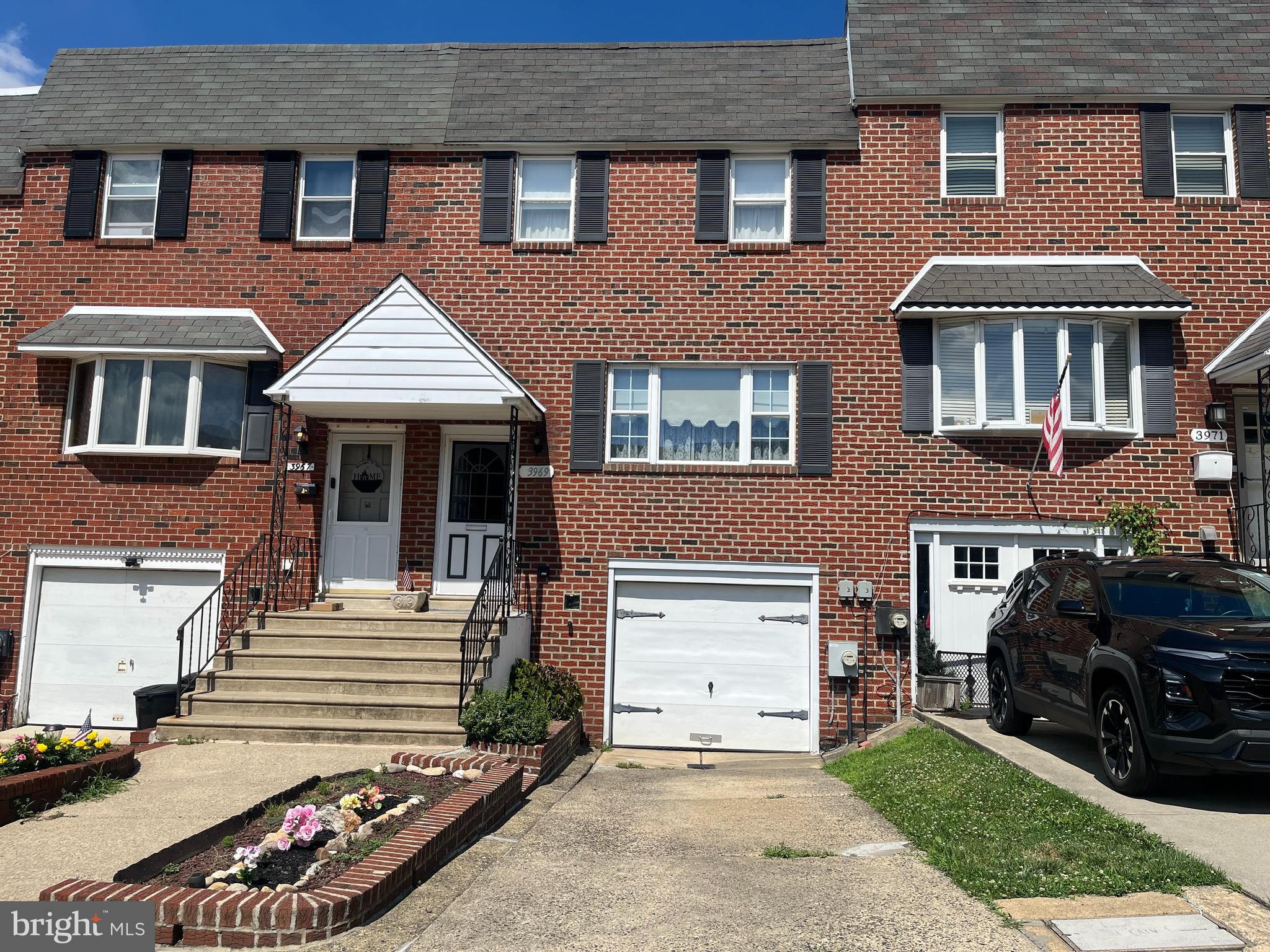 Welcome to this lovingly-maintained, all-brick, 3 bedroom, 1-1/2 bath row near Holy Family U!  Current Owner has lived here in  " Brookhaven"  since 1987!     There is a Front Concrete Driveway & Front Garage for Off-Street Parking - Foyer Entry, Step Up to a Bright Living Room w/Wide Picture Window; W/W Carpet & Roomy Coat Closet - Formal Dining Room - Large Eat-in Kitchen w/Ceiling Fan,  SS Sink, Window above overlooking huge yard;  Newer, high horsepower Garbage Disposal, Kitchen Aid  Dishwasher, Gas Counter Top Stove, Gas Eye-Level Oven, Handy Pantry Closet, Convenient 1st Floor 1/2 Bath.  Upstairs are 3 Good-sized Bedrooms; Main Bedroom has 2 Double Closets Plus a Spacious Walk-in Closet (could be location for a Master Bath); Ceramic Tile Full Bath w/Vanity Sink; 2 other Bedrooms w/W/W Carpet, Closets:  Downstairs there's the Laundry Room, Washer & Dryer Stay, incl. Laundry Tub. Steel Door provides inside Access to Garage w/insulated ceiling; 100 AMP C/B - The Large Finished Basement is Paneled, features Beamed Ceiling, Gas Fireplace (gas to it is off, not used lately); w/w Carpet - Mechanical Area is Enclosed- contains Gas Hot Air Heater & Gas Hot Water Heater (2021).  Exit from Finished Family Room to Large Cement Patio - Rear of House Brick Pointed, Windows Alum. Capped,  Outside Electric; Deep Fenced Grass Yard, Central Air Compressor, Roof's been Maintained, Heater Serviced Regularly.  Decorate yourself & save $Thousands, This Clean Home will Shine w/your Cosmetic Touches!  Close to Holy Family University, Torresdale Train station, & Bus on Frankford Ave,  Transportation is easy to CC, & I-95, Restaurants, Shopping & Beautiful Golf Courses, too!   See it Today!  Immediate Possession OK!