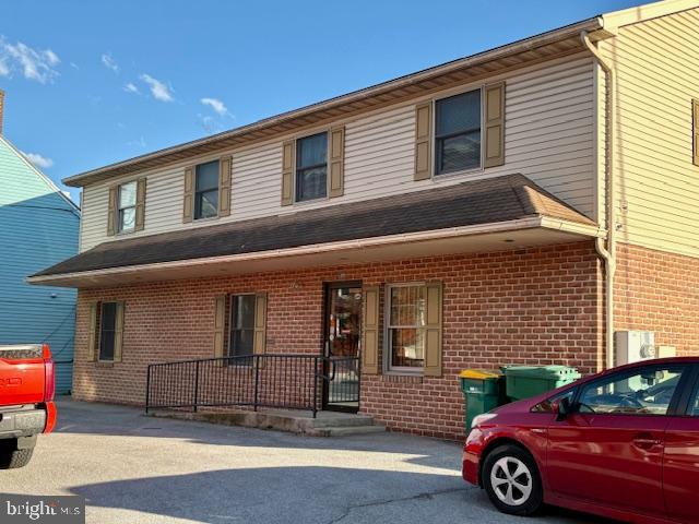 INVESTMENT OPPORTUNITY! First floor commercial space is vacant, is in great condition, and is available to make it yours! Run your own  business through here, or lease it for added income. This space includes a waiting area, reception window, 4 private offices, an open office area, two half bathrooms, a kitchenette, several storage closets, and two more rooms which could be used as offices or storage. 
The second floor consists of two residential units, both currently occupied.
Includes 8 parking spaces total - 4 in front for the commercial space and 4 along the side for the residential tenants. 
48 hours notice is required for showing residential units.