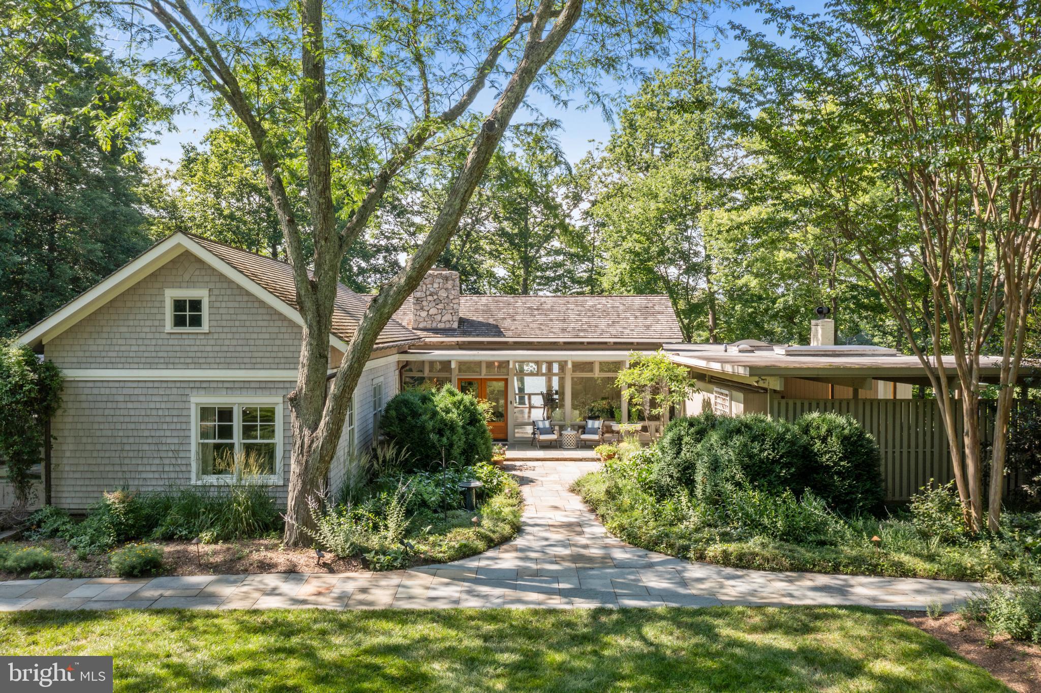 Welcome to 917 Arbutus Road—a waterfront property nestled on 5 private acres with deep water on Crab Creek  minutes from downtown Annapolis. This mid-century modern home offers over 3656 SF of light-filled living space, high ceilings, expansive glass walls, and panoramic views of water.  The main level boasts four bedrooms and open-concept living areas designed for both comfort and entertaining. Enjoy sunsets from the oversized deck or relax by the heated saltwater pool and a charming private guest/pool house with an additional 470 feet comfortable living space. Deep-water at the pier (10 ft MLW), the  300+ feet of frontage  and the direct access to the South River and Chesapeake Bay. A large barn offers endless possibilities—perfect as a workshop, recreation space, or artist studio. Located just minutes from downtown Annapolis yet tucked away in complete privacy, this is a rare opportunity to own a legacy property with timeless appeal and modern amenities.  All bathrooms, kitchen, pier and barn in need of renovations.
 Purchaser bought all 4 Parcels with Four Tax ID's in this transaction with the following values assigned to them:  1) LOT 1R, a 1.88 acres waterfront lot with 104.01 ft of water frontage Tax ID: 020200007365075) for $1,700,000.  2)  LOT 2: 1.52 acres - (Tax ID: 020200090231514) for $560,000 3. Lot 3, (Tax ID 200090231515) 1.51 Acres for $560,000. The main house that sat on a 5 acres lot, 917 Arbutus Banks Lot 1R (Tax ID:200307365700) for $5,060,000.