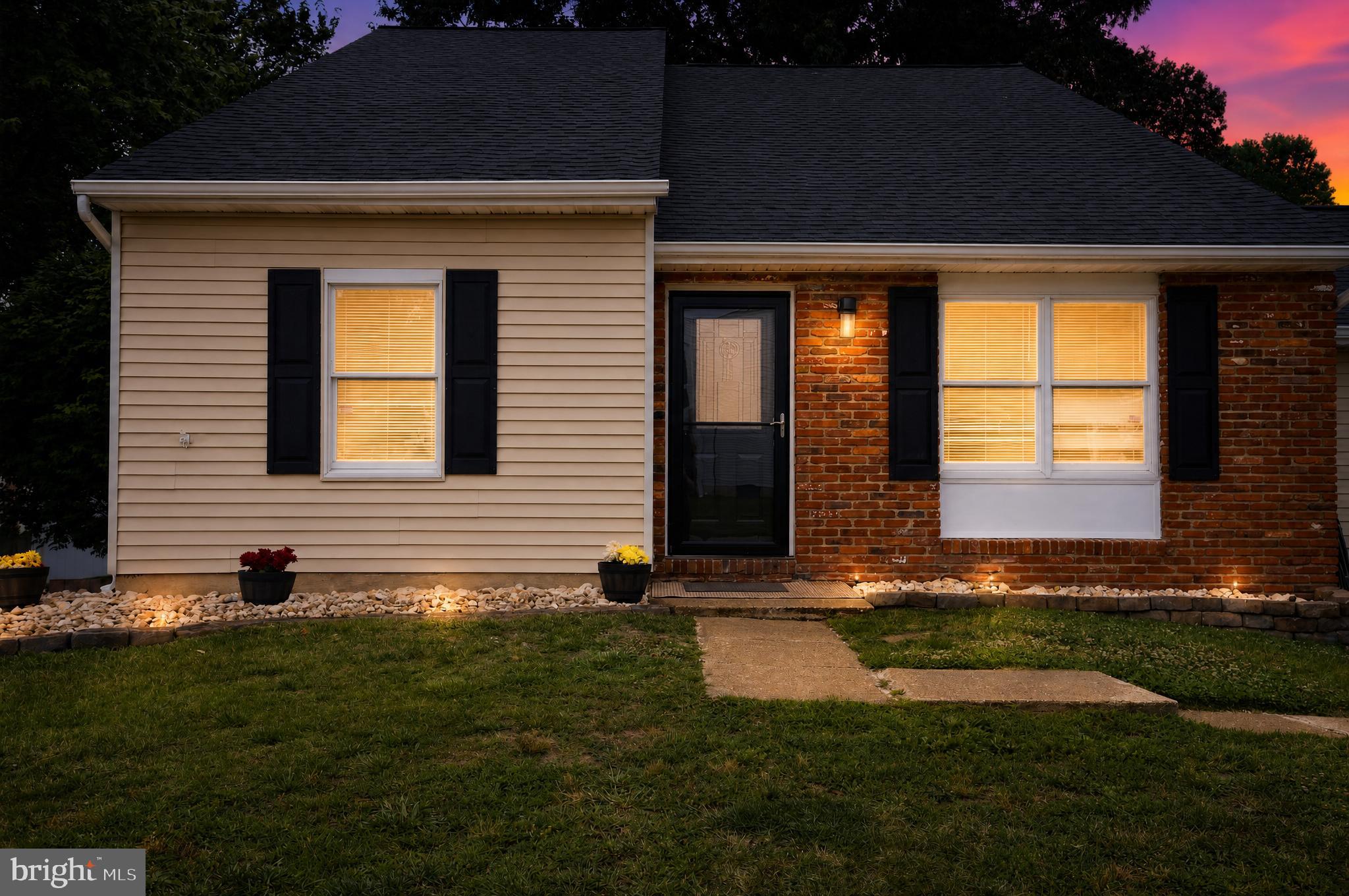 Welcome to your dream home! This stunning 2,200+ square foot residence boasts a fresh, modern feel with brand new wall-to-wall paint throughout. Positioned on a corner lot in sought-after Linthicum Oaks, this beautiful 4-bedroom, 2.5-bath home has everything you're looking for. The bright living room features an electric fireplace and soaring vaulted ceilings that create an open and airy feeling from the moment you step inside. The updated kitchen features all-new top-of-the-line stainless steel appliances, sleek quartz countertops, quartz countertops, white cabinetry with hardware, recessed lighting, a dedicated coffee station, and an island that is seamlessly positioned in the dining room. New finishes and hardware elevate every detail.  Just off the main living areas, the expansive 19’x15’ family room offers plenty of space to relax and includes a sliding glass door leading to the screened-in porch. A flex room/office also provides access to the rear deck. The first floor also includes the 4th bedroom and laundry room, and powder room. Upstairs, you'll love the brand new plush carpet. The impressive 22’x15’ primary suite includes a large separate sitting room with attic access, a walk-in closet, and a private bathroom. Two additional bedrooms and a second full bathroom complete the upper level. Plus, rest easy with a roof and a fully enclosed, six-foot white vinyl privacy fence—both less than two years old! Enjoy a screened-in porch, rear deck, private driveway, and abundant street parking. Ideally located within walking distance to Linthicum Elementary and Linthicum Park featuring playgrounds, ball fields, tennis courts, and walking trails. Conveniently situated near shopping, BWI Airport, Northrop Grumman, and major commuter routes. Don’t miss your chance to call this beautifully updated gem yours!