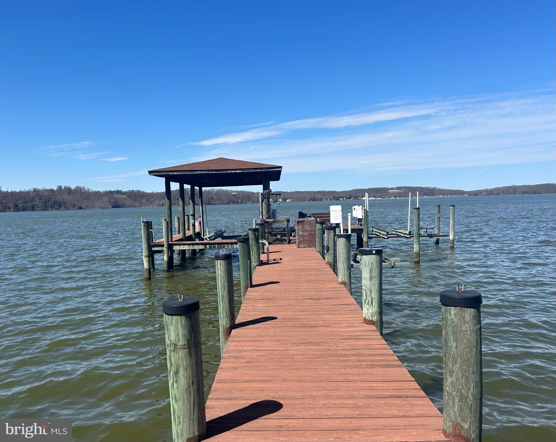 ***PRICE DROP ALERT!!!***RARE opportunity to own nearly 4 acres of mostly cleared and slightly elevated waterfront land in Stafford, VA. With stunning sunset views and natural elevation, this property offers the perfect setting for your future dream home or private retreat with potential for panoramic water views. Features include a covered boat dock with two boat lifts and a jet ski lift, plus existing septic, well, and electricity already on site— all conveyed as-is, with conditions unknown. Bonus structures include a pole barn, camper, and a few other small structures — all conveyed as-is, with conditions unknown. Don’t miss your chance to enjoy peace, privacy, and direct water access on this truly special piece of land.