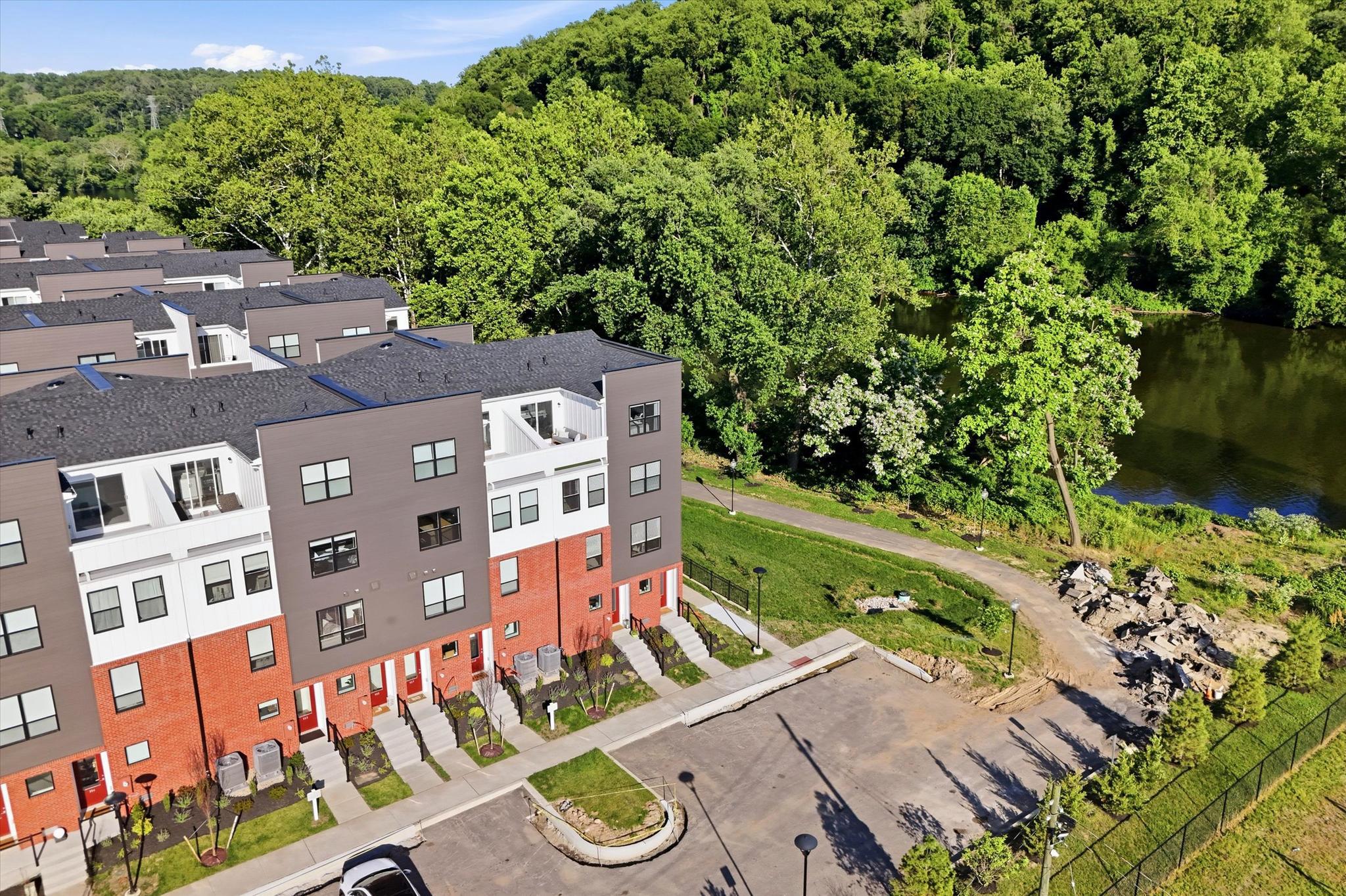 RIVERFRONT END UNIT - Experience luxury riverfront living in this vibrant, award-winning townhome community, named “Townhome Community of the Year.” Just five months young, this upgraded end-unit townhome offers river views, an open-concept layout, abundant natural light, tall ceilings, oversized windows, and designer lighting throughout.

The main living level features hardwood flooring, a timeless kitchen with quartz countertops, stainless steel appliances, and seamless flow for everyday living and entertaining. The home offers 3 bedrooms and 2.5 baths, including dual owner’s suites with walk-in closets. The top level includes a wet bar and access to a private rooftop deck with beautiful river views. Not to be missed is a built-in tandem 2-car garage. 

Enjoy low-maintenance HOA living with river views, pocket parks, an observation deck, and direct access to the Schuylkill Trail and Spring Mill Train Station, all in the acclaimed Colonial School District. With a small-town feel, walkable restaurants, and quick access to I-476, I-76, the PA Turnpike, and Center City Philadelphia in under 25 minutes, this location offers the best of convenience and lifestyle. Schedule your tour today.