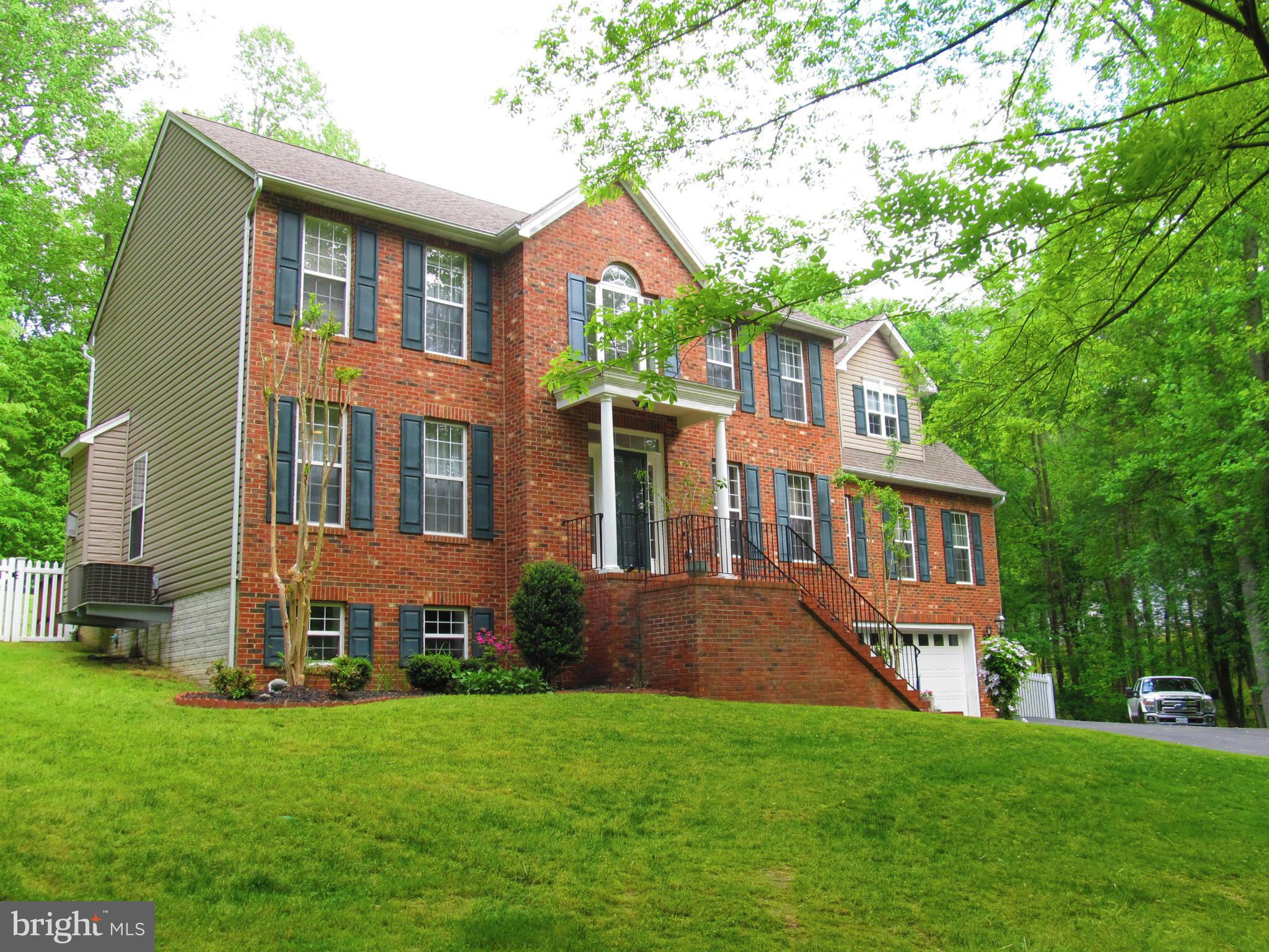 No reason to wait for new construction after you see this 4000+ sq ft beauty! Home features large rooms, 2 fireplaces, office w/built in bookcases, bonus family room over garage. Many upgrades throughout, including crown molding, hardwood floors, countertops. Large master suite w/3 closets, sep. Shower and jetted tub. All this on an acre of land w/large fenced area.