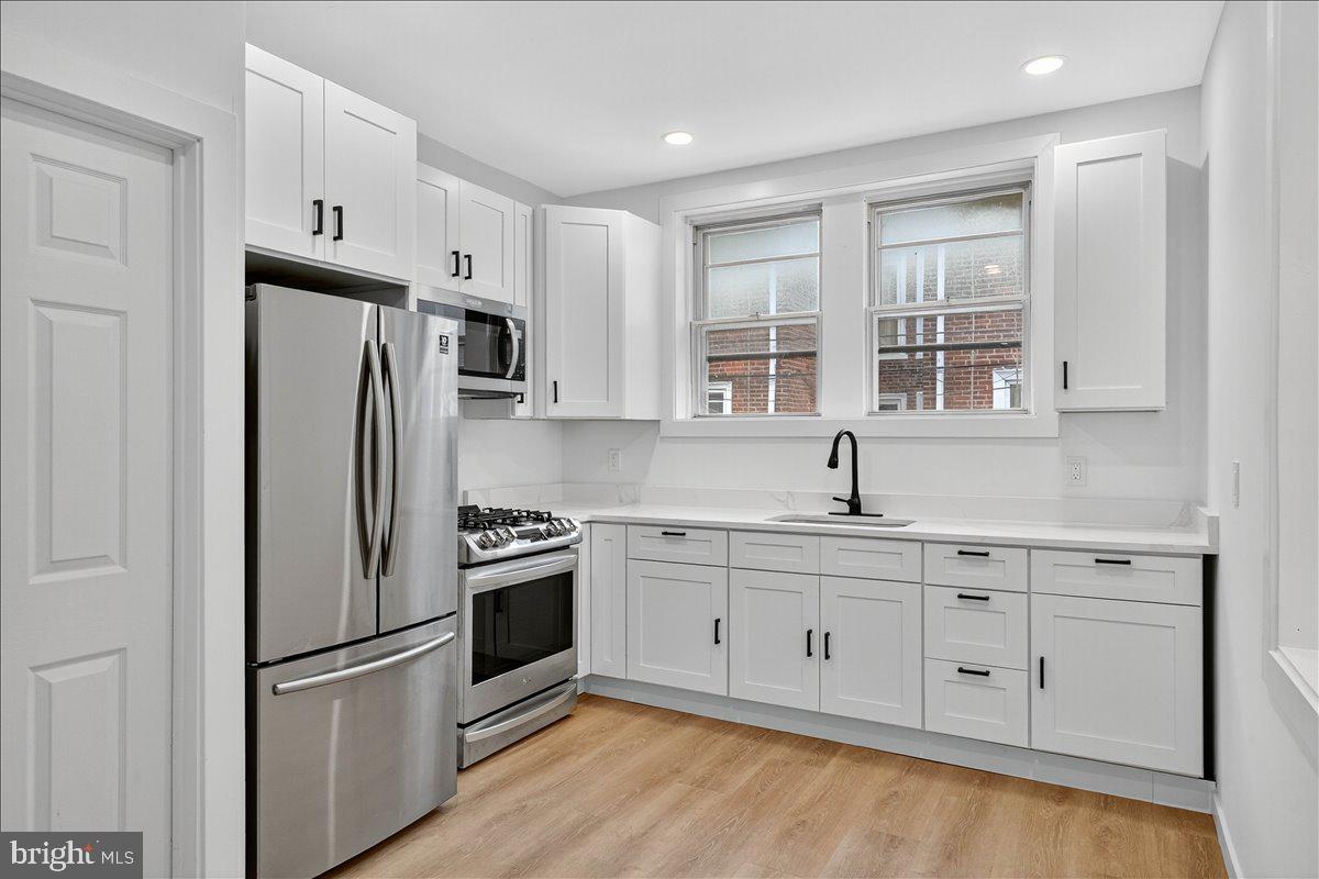 Welcome to 6737 Smedley Street in the heart of West Oak Lane. This stunning 4-bedroom, 2-bathroom home has been completely renovated from top to bottom and is truly move-in ready. Step inside to find a spacious, open-concept layout filled with natural light. The brand-new kitchen features modern cabinetry, quartz countertops, and stainless steel appliances, flowing seamlessly into the dining and living areas—perfect for both everyday living and entertaining. Every major system has been updated for peace of mind, including new HVAC, electric, plumbing, and a brand-new roof. Both bathrooms have been fully remodeled with contemporary finishes. Upstairs, you’ll find generously sized bedrooms, while the finished lower level offers additional living space, ideal for a family room, office, or gym. Enjoy the outdoors with a newly built deck perfect for entertaining or relaxing. Located in the desirable West Oak Lane neighborhood, this home provides convenient access to shopping, schools, parks, and public transportation. Schedule your showing today!