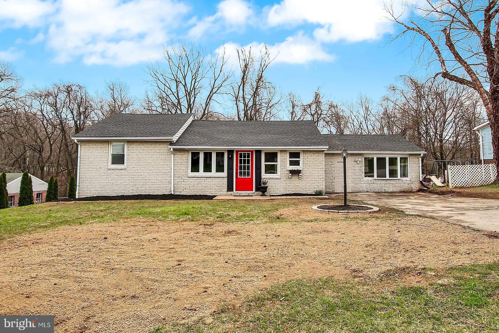 NEW, NEW, NEW! All brick rancher features new flooring throughout, new heat pump, new roof, new hot water heater, new electric and new plumbing. Granite counter tops in kitchen. Massive master bedroom could also be used as a family room.  There is a brick, propane fireplace in what could be used as dining space, a sitting room or an extension for full master suite with a covered porch to the secluded back yard area. Den/Game room in basement  could also serve as a bedroom/guest room and features french doors that walk out to a paver patio with scenic wooded views. So many options for use of space in this beauty. Come see it today!