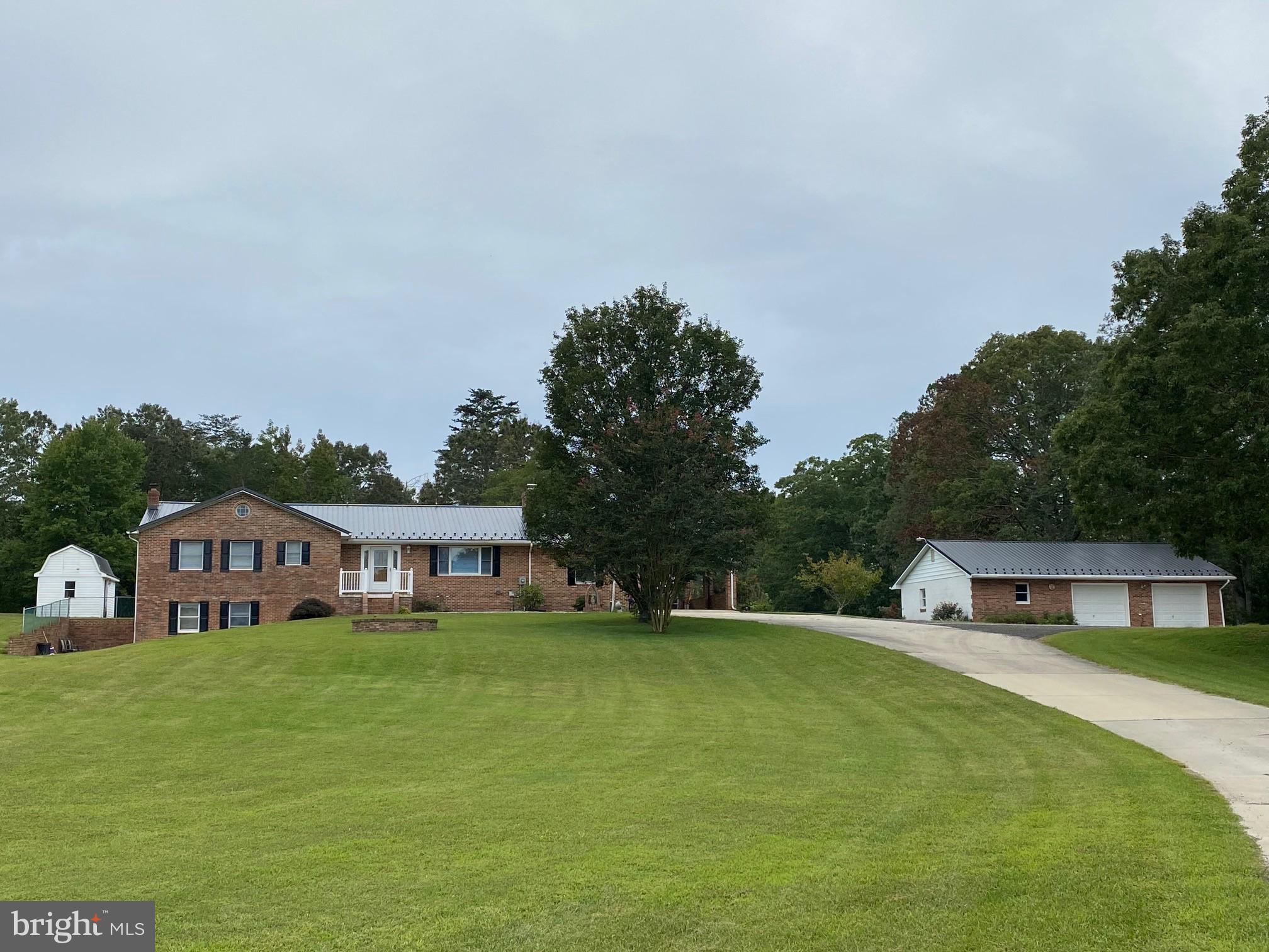 Estate sale in Hollywood.  All Brick construction.  Newly installed metal roof on house & garage.  House has been freshly painted.  New carpet. Oversized shop/ garage is 45 x 28.  No HOA, RMA