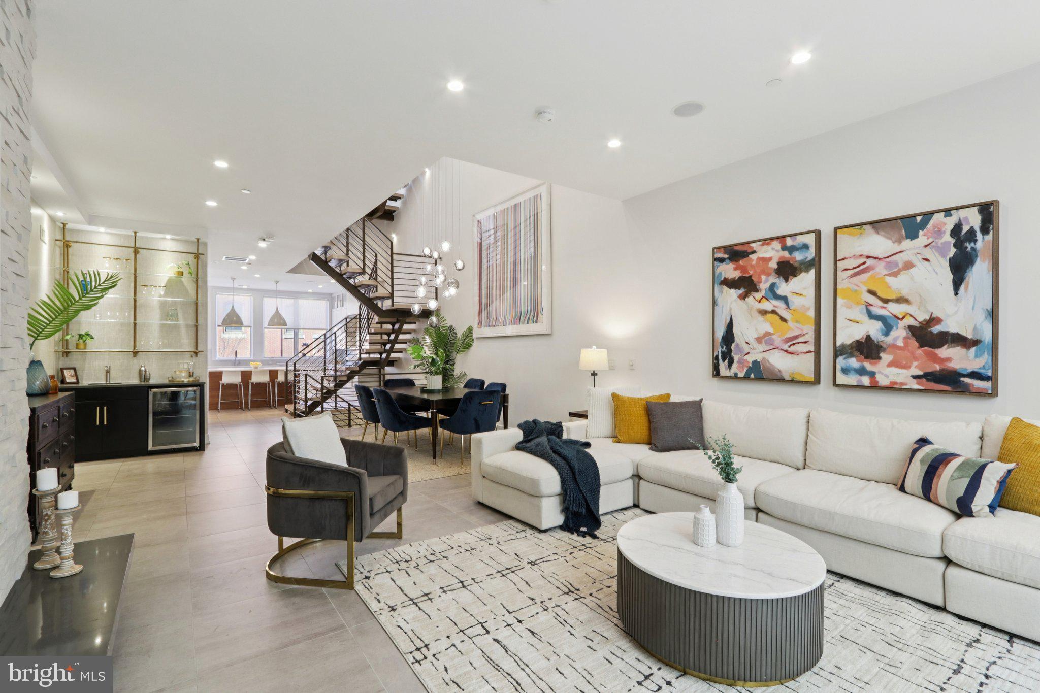 Designed by Shimi Zakin, who Philly Mag opined is the “most creative modern architect practicing in Philadelphia right now,” 207 S 22nd offers superior spaces and volume throughout a gracious Rittenhouse Square neighborhood home with over 5,000 square feet of livable space. This includes just over 3,900+ square feet, plus almost 1,000 square feet of outdoor space, intelligently sited among three different, highly functional outdoor spaces. Zakin hit a home run with this one!

This extra-wide home also offers 3-CAR PARKING—a 2-car side-by-side private garage and a 3rd secure and covered space just across from the garage. The 355 square foot garage completes the square footage noted above.

This home is not “too huge.” It is perfectly sized with gracious rooms, an ideal layout, balanced all-day light, and superb outdoor spaces.

4 bedrooms (or 3 bedrooms plus office), 4 full baths, 2 half baths, and an elegantly finished lower level that offers a family room and a den. This is not just a “basement,” rather it is seamlessly integrated as part of the home.

Not to mention the 6-stop elevator that goes from the lower level up to the spectacular roof patio with skyline views.

Imagine living space with soaring ceilings and huge windows, bathed in all-day light. A brilliant atrium and center-staircase (hardwood and steel). Stunning light fixtures. State-of-the-art systems. Tasteful finishes throughout, including many custom, artisan built-ins commissioned by the owners. Chef’s kitchen with Sub Zero and Wolf appliances, wet bar, outdoor kitchen, dream primary bed and spa bath and amazing closets! Gorgeous hardwood floors. The outdoor spaces are amazing. They include a private patio off the living area. A west-facing terrace off the primary floor. And a walk-out full-floor roof patio with skyline views.

207 S 22nd offers so much in the most convenient Rittenhouse location. Two blocks to Rittenhouse square and all the restaurants, cafes, and shops of Rittenhouse Row. Easy walk to University City, including Penn, Drexel, CHOP, HUP, and 30th Street Station. Also, a convenient walk to Midtown Village, Thomas Jefferson University, the Parkway and museums, Schuylkill River Trail, Trader Joe’s, Giant, and all of Center City. No wonder this property in the GREENFIELD SCHOOL CATCHMENT has a 99 WalkScore, 100 Transit Score, and a 98 Bike Score.

Luxury, Space, Light, Volume, 3-Car Garage Parking, Convenience, Location, and stunning outdoor space. This stellar home has it all.

NOTE--The HOA covers the common parking driveway and security gate (maintenance, insurance, etc.)