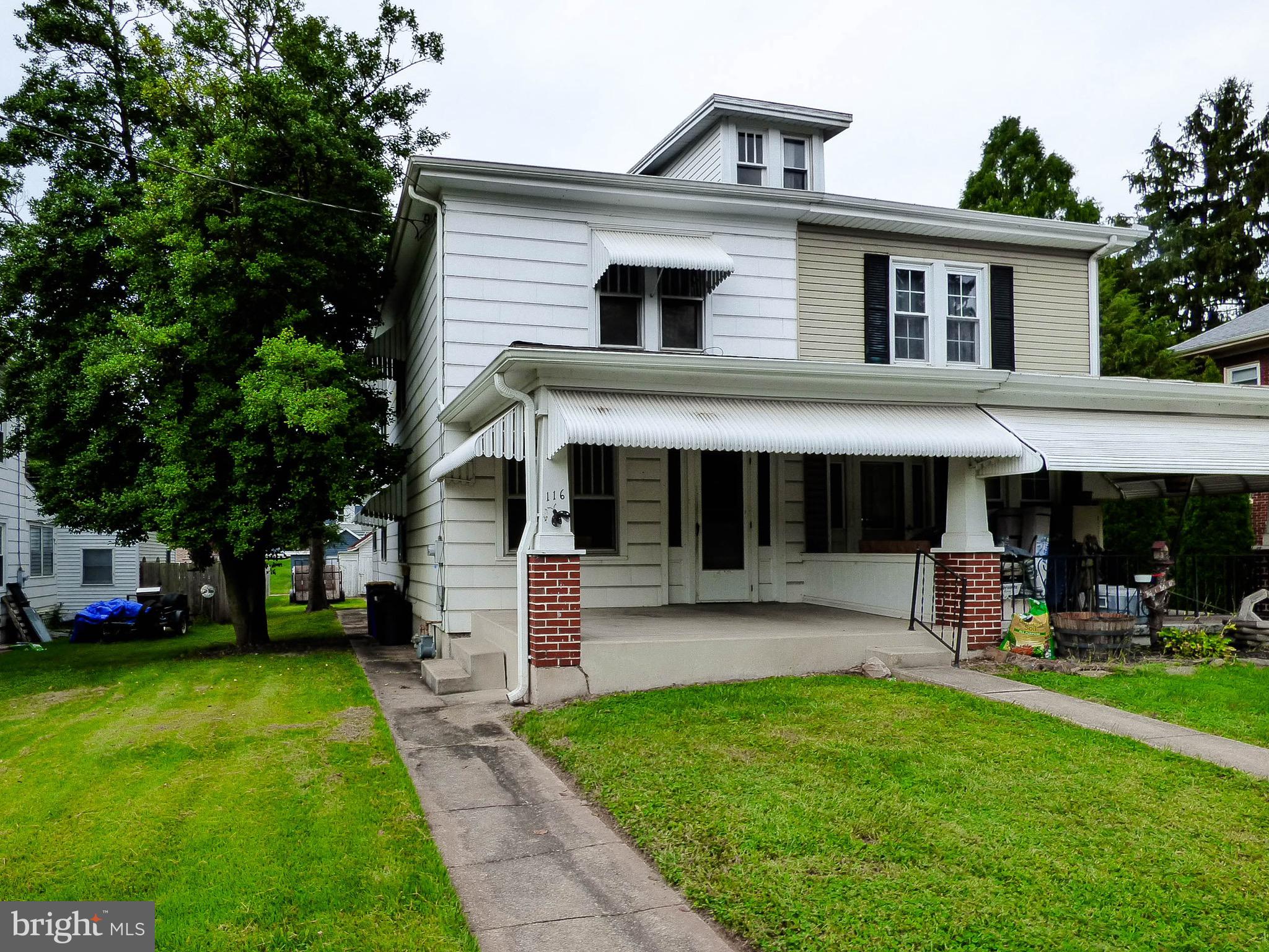 Semi-detached home located immediately across from the Mt. Wolf public park!  Walk across the street to the tennis courts, the basketball court and swigs and slides!  This home has a full front porch, 3 bedrooms, 1 1/2 baths, a 1st floor laundry room, a self cleaning gas stove, a refrigerator, hardwood floors, ceiling fans and lights in every bedroom, storage in the floored attic and tons of storage in the full unfinished basement.  This home has a modern forced hot air gas furnace, a 40 gallon gas water heater and an updated full bath.  This property would be FANTASTIC for a family looking to flip their own home as they could have tons of equity if done right - the location is perfect for it!  Hurry before someone else  gets the potential  before you miss out!