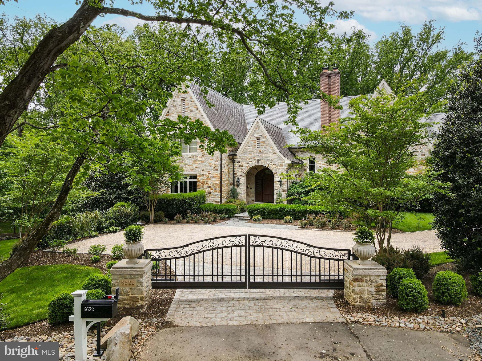 Prepare to be captivated by the opulent transformation of this French Country custom estate. A meticulous and extensive renovation has elevated this residence to a realm of unparalleled luxury. Nestled within the prestigious Langley Farms, this grand 13,000 sq ft sanctuary sits on an expansive 1.17-acre lot, ensconced in immaculate landscaping. Designed by the esteemed Sutton Yantis Associates and crafted by Bowman & Associates, this architectural masterpiece radiates a resort-like allure. Every detail has been thoughtfully curated, from the Antiqued Ashlar Stonework to the Vermont slate roof, copper gutters, and downspouts. The pièce de résistance is the inviting heated pool with its graceful waterfall, creating a tranquil oasis in your own backyard. The outdoor space is a paradise of its own, featuring a stacked stone Fireplace with a charming Pergola, a picturesque pond with a cascading waterfall, and sprawling park-like grounds adorned with majestic trees. Flagstone Patios & Terraces provide ample spaces for relaxation and entertainment, inviting you to savor the serene beauty of nature. As you step through the grand custom door with exquisite inlaid cut glass, a world of elegance unfolds. The formal Foyer welcomes you with a stunning staircase, setting the tone for the luxury that awaits. The Living Room boasts a comforting Fireplace and French Doors leading to the Flagstone Terrace, while the banquet-sized Dining Room is graced with a dramatic floor-to-ceiling inlaid wood mantle and French doors opening to a private garden. A complete Butler's Pantry off the Dining Room offers both display and storage space, adorned with marble countertops, under-cabinet refrigerator, and wine chiller. The Library, paneled in rich mahogany, features floor-to-ceiling built-in custom cabinetry and beckons you through beautiful French Doors into the Living Room. The Family Room is a visual masterpiece with its dramatic 2-story beamed ceiling, stone Fireplace, and double French doors that open to the Flagstone Terrace. The renovated gourmet Kitchen boasts custom cabinetry, top-of-the-line appliances, and a cozy floor-to-ceiling stone fireplace. Adjacent, the Breakfast Room is surrounded by windows, creating the perfect spot to start your day with a view. Ascending to the Upper Level, you'll discover the luxurious Owner's Suite Bedroom with French doors leading to a private covered Balcony. A Sitting Room awaits, complete with Balcony access, Fireplace, and a Morning Bar. The dressing area includes two custom Closets and a large cedar Closet. The opulent Bath is a masterpiece with heated Turkish marble floors, a cove-lighted tray ceiling, freestanding soaking tub, and a glorious shower with rain shower and body sprays. The Upper Level also comprises four additional en suite Bedrooms, each with meticulously renovated Bathrooms, and one graced by an additional Fireplace. Descending to the Lower Level, you'll find an entertainment haven. A Recreation Room beckons with a fireplace, fully equipped Wet Bar. The Wine Cellar and Tasting Room designed to accommodate 500+ bottles, awaits the connoisseur. Additional spaces include a Billiard Room/Bedroom, Full Bath, Fitness Room, Sauna, and a Golf Room with a fully interactive Golf Simulator. Multiple sets of French doors lead to the covered lower Flagstone Terraces and the rear tranquil garden grotto. This haven is adorned with clematis-covered arbors, a stone fountain, and beautiful rose and hydrangea gardens. This remarkable residence is thoughtfully equipped with modern conveniences, including a custom-designed Entry Gate, Elevator with 3-level access, Vacuflo central vacuum system, natural gas Generator, and an oversized 3-car garage. This is not just a home; it is a masterpiece of luxury living, offering an unparalleled lifestyle in the heart of Langley Farms. Experience the epitome of elegance and comfort in this meticulously curated estate.