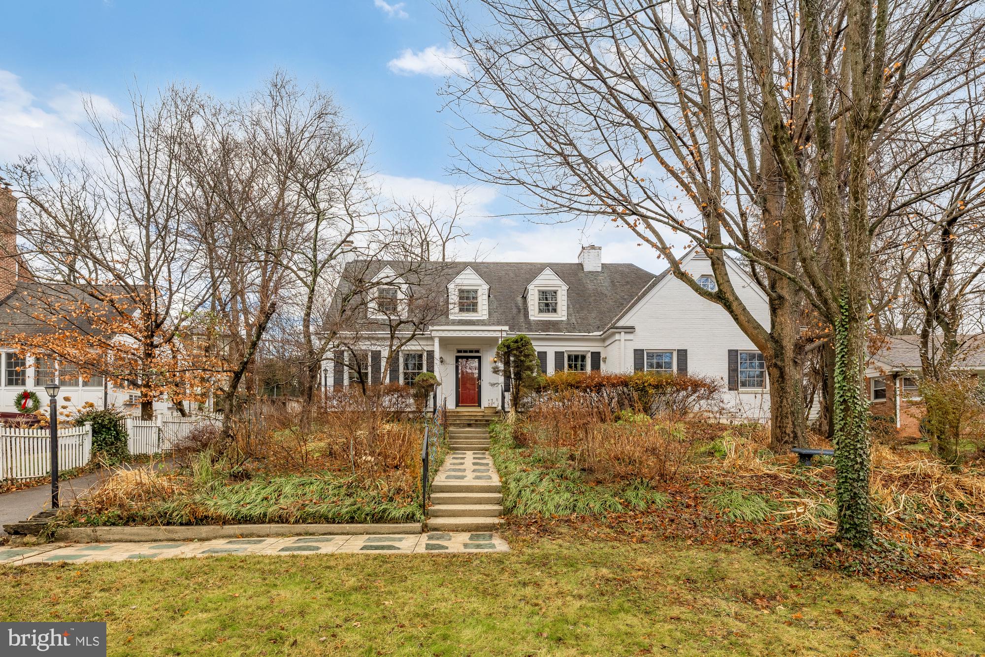 Price just improved on this truly special offering!! Sitting up a gentle hill in a serene and private setting, welcome to this English Village expanded "story book" cape cod! With room dimensions unlike any cape you have seen before (and will probably ever see again..) this central Bethesda stunner offers classic charm, tasteful modern updates, and the option for easy one level living or even further future expansion! <br>

As you enter the home through the charming stone front porch you'll note warm hardwood floors that can be found throughout the main and upper levels of the home. The main level impresses with three bedrooms, all with ensuite baths and all that could function as alternate spaces (one currently doubles as an office while another is currently structured as a massive family room). The formal living room boasts a gas fireplace and the formal dining room features updated lighting and can accommodate a grand dining table - no relative left behind over the holidays and designated to a kids table again:-) The updated kitchen features bespoke vintage cabinets melding with a just updated white quartz counter and backsplash. The size of this chef's kitchen makes preparing meals a breeze with a gas cooktop and large wall oven, and benefits from loads of light both through the sink picture window as well as the connected breakfast area skylights and large format windows looking out over the rear gardens. The breakfast area itself features a full sink and plumbing for your own bar nook, and is so largely proportioned that it could be used both as an informal dining area as well as an additional family room area, And off this area is also a grand deck again looking out over the picturesque rear gardens (images in full bloom included within the pictures). But the highlight of the main level is without a doubt the quiet and secluded massive primary bedroom which features a dual vanity marble bath and a custom walk-in closet. <br>

Upstairs you'll find two well proportioned bedrooms each with additional custom closets. The recently updated hall bath sits between both bedrooms and boasts a classic white subway tile design with black trim and features. Also on this level is a gorgeous loft area - again of grand proportions! This loft could be used for multiple home office spaces, yet another family room, an upper level gym or art studio -- the options are nearly endless! And as if this weren't enough already, the lower level of the home offers yet another living room complete with a second fireplace, a wood paneled den which offers a relaxing reading area or potential for a media room, yet another full bath, and loads of area for additional storage or perhaps even a home gym! <br>

Other highlights of this impressive property include a two car garage with EV charger, a recently updated boiler, additional parking as well as a turn around paved car-pad (you need never back out onto Bradley, plenty of room to turn around!), updated paint throughout most of the home, and more.. Moments to both the Bethesda Metro and all Bethesda Row has to offer and in the current bounds for Bradley Hills Elementary, Pyle Middle, and Walt Whitman High School, this home offers a rare opportunity to find the prefect sized home (good for those looking to upsize, or even perhaps to "downsize" onto what could offer mostly one level living..) and all at a price that's rarely found this closely tucked in the heart of wonderful walkable Bethesda!