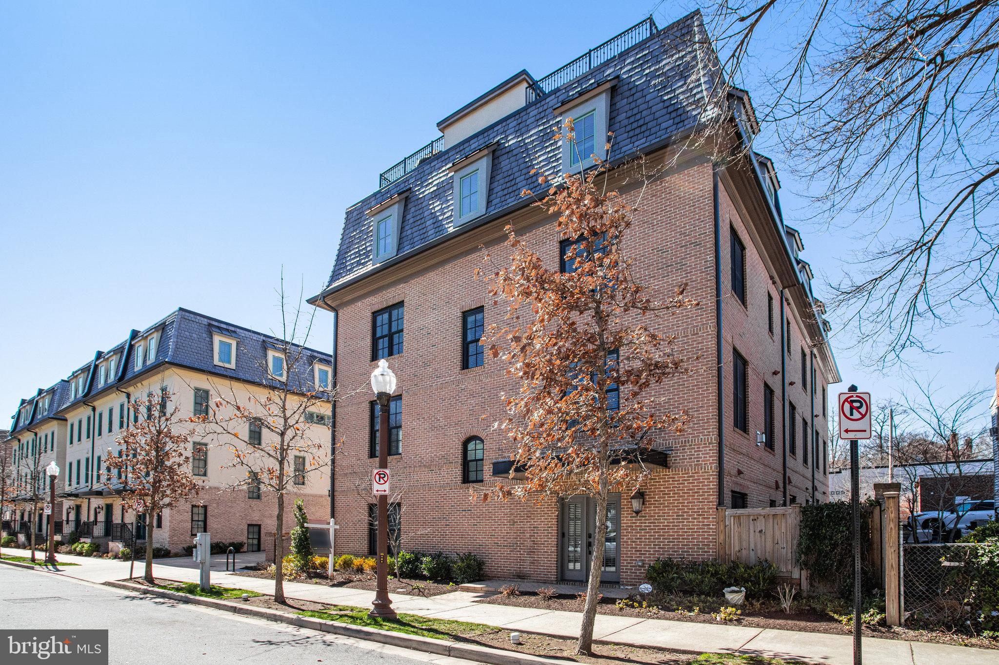 Single Family Home "feel" BUT it's a Town home with NO maintenance. LOCATION! Amazing 5 years NEW. Luxury town home, end unit, in the heart of Ballston. 2 car garage, 2 additional spaces on driveway, plus visitor parking. Immaculate condition with extensive upgrades when built: elevator to ALL levels, sound proofing insulation throughout, custom built in cabinets added for additional kitchen storage and counterspace, gas fireplace, hardwood floors throughout (3 rooms with new carpeting), plantation shutters, murphy bed option in office space with custom built-ins, EV charger, hard line gas grill on personal/private rooftop deck, and more! 3 blocks to the Ballston Metro, restaurants, grocery options, Washington Liberty HS, Ballston Mall and Kettler Center. Gourmet kitchen/living level, master bedroom suite level with walk in closets, laundry center and heated floors in a sumptuous primary bathroom. Rooftop with spectacular views (think 4th of July fireworks!) and dual sided space for entertaining. Freshly painted throughout, light and bright, move-in ready, amazing opportunity!