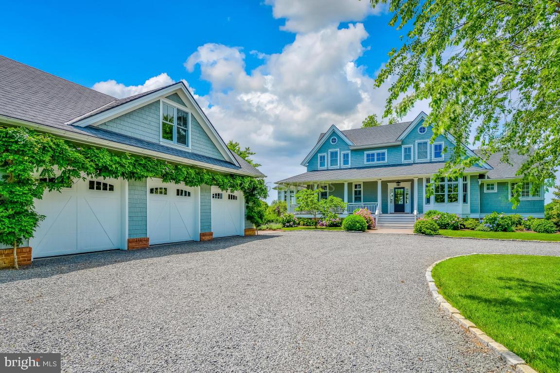 Truly spectacular Nantucket Coastal inspired sprawling estate overlooking  Newport Bay on a magnificent piece of land in the exclusive neighborhood of Indian Creek.  Immerse yourself in the ambiance of this luxurious waterfront lifestyle.  This sensational 4296 sq ft estate is on 4.15 acres directly on the waterfront with a boat dock, pier and privacy, and is minutes from Assateague Island and Ocean City in one of the Eastern Shore's finest vacation destinations. This estate was impeccably designed by Jeff Schoelkopf and built by Dovetail Construction, a renowned builder in the region.  The property features exceptional craftsmanship with astute attention to detail.  This home is built for the sophisticated buyer looking for custom finishes, energy efficiency and a touch of class.