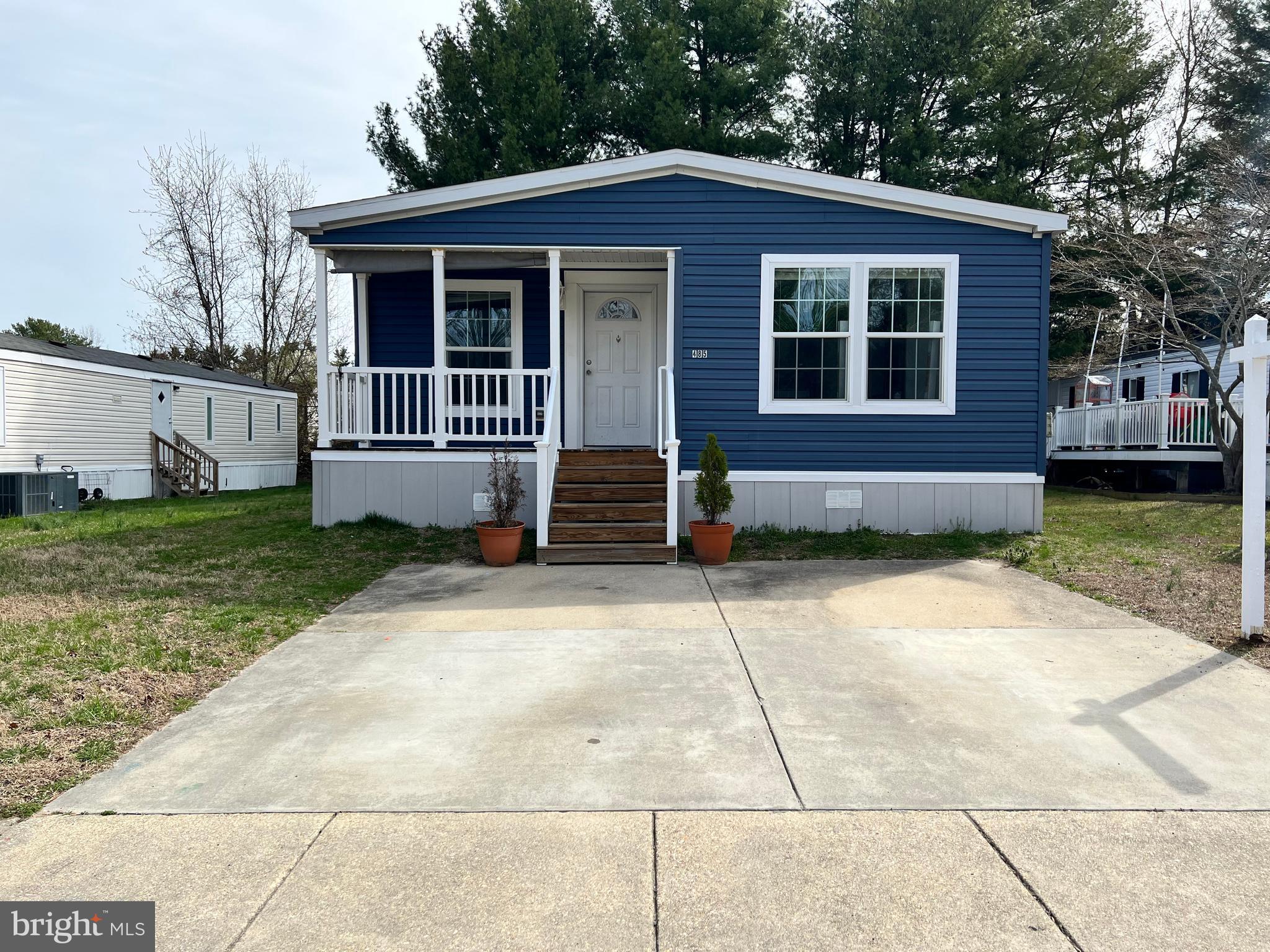**Spacious Double-Wide | 3 Bed / 2 Bath |  1,500 Sq Ft**

Welcome home to this beautifully appointed double-wide offering nearly 1,500 square feet of thoughtfully designed living space. From the moment you arrive, you'll appreciate the covered front porch — perfect for morning coffee or evening relaxation — along with generous side yard space and a handy 10x10 storage shed.

Step inside and you'll immediately notice the quality throughout, starting with **real drywall** (not drywall panels) giving every room a solid, finished feel. The open-concept kitchen is a true showstopper, anchored by a **huge island with seating** — ideal for entertaining or casual family meals. The built-in entertainment center with sliding **barn door** adds stylish character to the living area, while the **electric fireplace** creates a cozy ambiance year-round.

The primary suite is your personal retreat, featuring a **walk-in closet** and an oversized shower. Two additional bedrooms and a second full bath offer plenty of room for family or guests.

**Recent updates take the worry out of ownership:** dishwasher replaced June 2025, roof repaired March 2026, plus all-new blinds for every window. As a bonus, **5 gallons of paint are included** — move in and make it your own from day one.

Tucked away on a **back, quiet street**, this home still keeps you close to everything the community has to offer — including **trash and water covered by HOA fees**, sidewalks, playgrounds, a pool, tennis court, and basketball court.

*This one checks every box — schedule your showing today!*