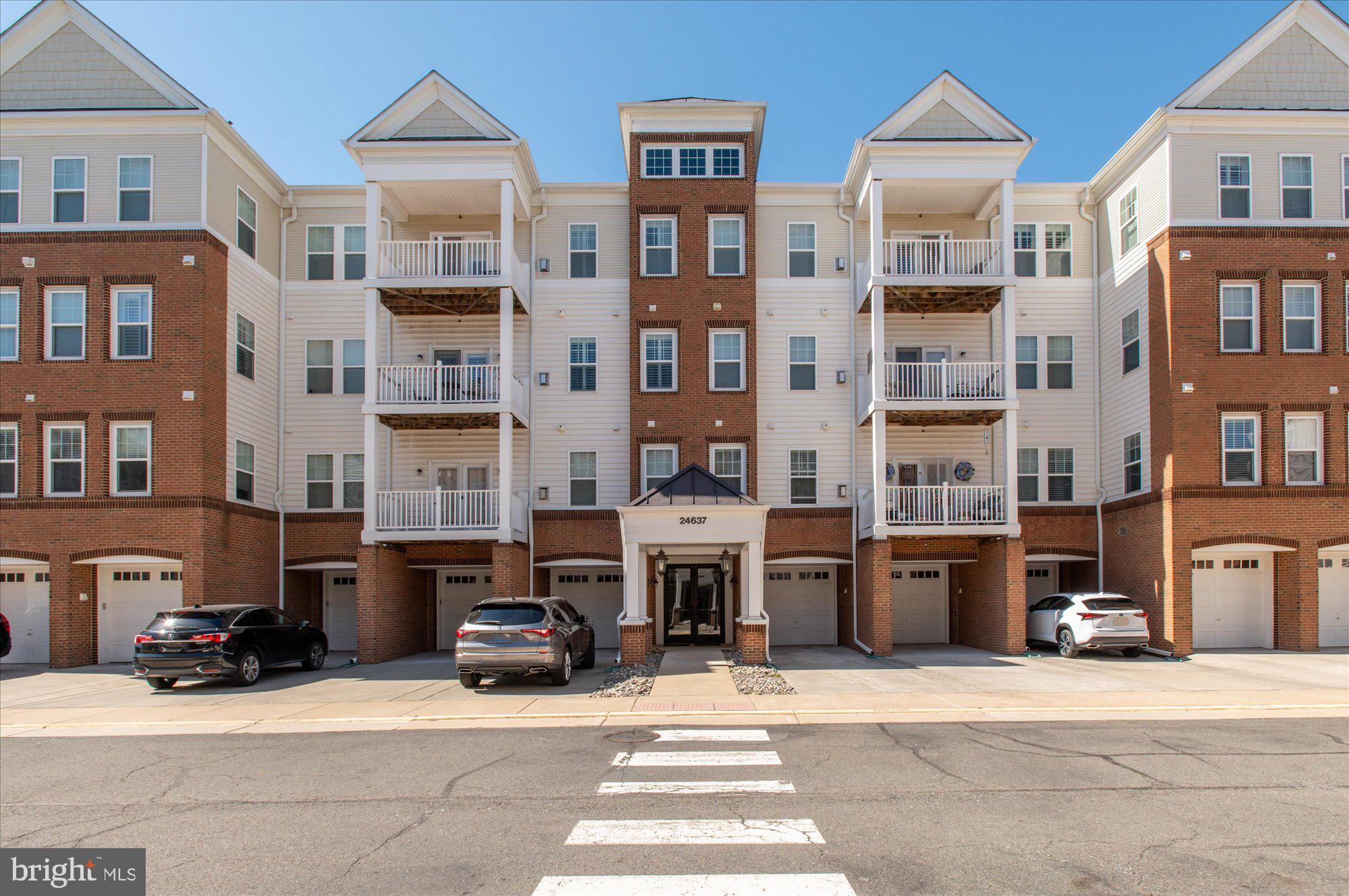 SPECTACULAR ONE LEVEL CONDO IN HEART OF STONE RIDGE COMMUNITY BOASTING OVER 1500 SQFT WITH 3 BEDROOMS, 2 FULL BATHS AND 1 CAR GARAGE.  COVERED ENTRY TO SECURED BUILDING CONVENIENT SECOND FLOOR ACCESS BY ELEVATOR OR STAIRS UNIT #206 HAS WELCOMING FOYER GENEROUS LIVING ROOM WITH WOOD FLOORS, GAS FIREPLACE WITH MANTEL AND EXIT TO BALCONY KITCHEN INCLUDES PANTRY, BREAKFAST BAR, STAINLESS STEEL APPLIANCES AND GRANITE COUNTERS PRIMARY SUITE WITH WOOD FLOORS, WALK-IN CLOSET, ENSUITE BATH WITH DUAL SINKS AND TILE FLOOR BEDROOMS 2 & 3 HAVE CARPET, CEILING FANS AND EASY ACCESS TO THE HALL BATH THIS WONDERFUL  CONDO HAS AN ATTACHED ONE CAR GARAGE SPACE WITH DIRECT ACCESS TO THE BUILDING! LOCATED IN CONVENIENT STONE RIDGE WITH EASY ACCESS TO SHOPPING, ENTERTAINMENT, RESTAURANTS AND COMMUTER ROUTES.