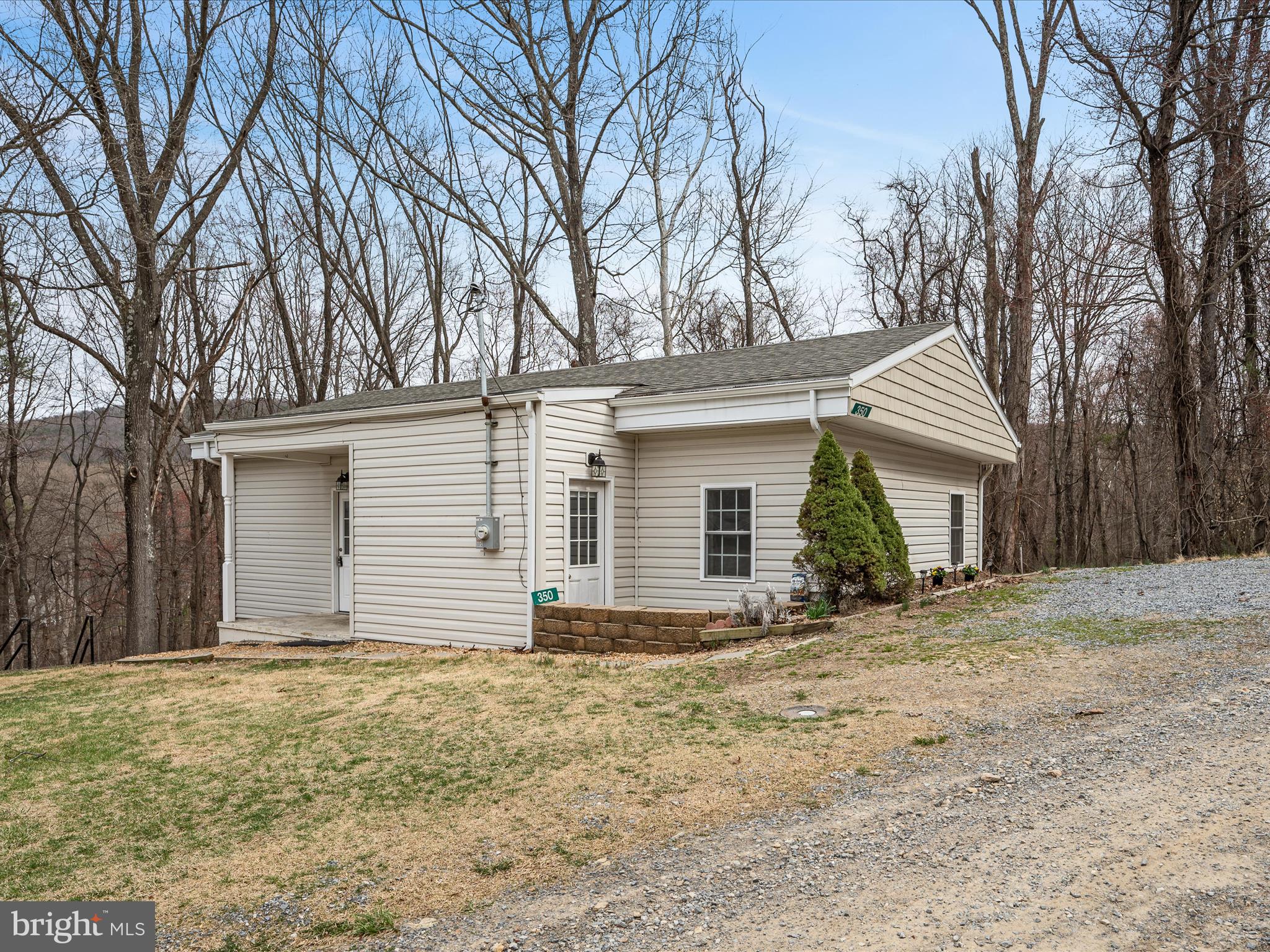 Welcome to Shenandoah Retreat, a private and serene community just minutes from Route 7 East and the Loudoun County line. Ideally situated near award-winning wineries, breweries, river access points, Bears Den, and the Appalachian Trail, this location offers the perfect blend of nature and convenience.
This beautifully renovated one level 2-bedroom, 1-bathroom home features: New kitchen with stainless steel appliances, Luxury vinyl plank flooring throughout, Cozy electric fireplace in the living room and private deck &  patios, perfect for outdoor relaxation.  All this surrounded by woods, offering a peaceful country setting.  As a property owner in Shenandoah Retreat, you'll enjoy hunting privileges with proper permits and two deeded river access points.  ** Recent Updates (2020) include -  Roof, HVAC,  Kitchen appliances, washer & dryer, water heater, plumbing & lighting.
Fantastic commuter-friendly location is just 20 minutes from Winchester and minutes from Loudoun County. Don’t miss this incredible opportunity—priced to sell!