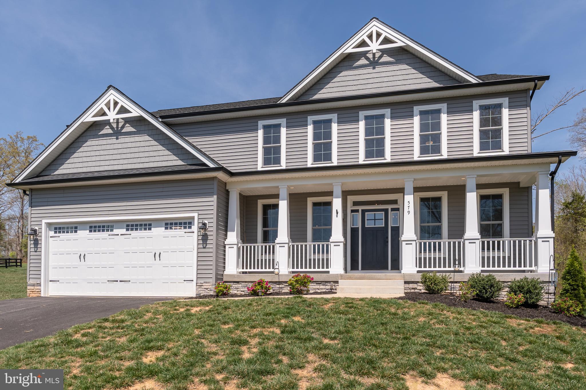 This stunning and upgraded WATER VIEW escape at Lake Anna, with nearby water access and your very own covered boat slip, was recently built in 2023.  This 4,400+ square foot home offers five spacious bedrooms, and is located in Elk Creek Landing—one of the area’s newer and more-popular subdivisions on Lake Anna's private side.   The main level features lovely LVP flooring, a first-floor bedroom, and a large living room with upgraded coffered ceiling, propane fireplace with beautiful mantle, and direct deck access.  The large upgraded kitchen - which opens up into the living room - showcases beautiful white quartz countertops, a large gas cooktop, stainless steel appliances, subway tile backsplash, pot filler, a large island, and a spacious pantry.  The large rear deck with a propane gas stub provides an easy outdoor setup overlooking your large backyard.   The second floor features LVP as well, and features four additional bedrooms, including a large primary suite with water views, walk-in closet with shelving, and a large bathroom featuring elegant tile flooring, a double vanity, standalone soaking tub, and large walk-in tile shower.  Three additional bedrooms upstairs, one of which is another primary suite with bathroom, plus another full bath upstairs and a convenient laundry room.  The massive walk-up unfinished basement offers expansion potential with plumbing rough-ins for a future bathroom.  Additional features include a large two-car attached garage, a spacious covered front porch with lake views, and an expansive private backyard.  GREAT location,  just minutes from local dining, groceries, vet clinic, ABC, The Lake Anna Taphouse, local coffee shop, and more.   Less than an hour from Richmond, Fredericksburg, and Charlottesville, and just 82 miles from Washington DC.  Short term rentals are permitted in this subdivision.
