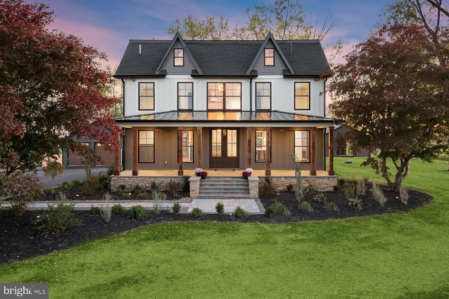 Introducing your dream home at 15775 Frederick Road, a stunning modern farmhouse perfectly designed for families seeking an idyllic rural retreat in highly sought-after Western Howard County. Set on a breathtaking 3.16-acre plot, this magnificent 5-bedroom, 4.5-bathroom, single-family residence offers an abundance of space. Sparing no expense from top to bottom complemented with quality finishes, detail, sophistication, and charm. From the moment you enter the tree-lined driveway, you'll be captivated by the beautifully landscaped grounds and inviting covered front porch with decorative wood beams and blue stone. Surround yourself with awe-inspiring panoramic views of the picturesque countryside, complete with a charming neighboring sunflower farm. The expansive deck overlooks multiple outbuildings. For the avid car enthusiast or farmer, the outbuildings have a plethora of possibilities.  Step inside and be greeted by gorgeous hand-scraped hardwood floors, exquisite lighting, and delightful details throughout. Oversized windows bathe the entire home in an abundance of natural light, creating an inviting atmosphere for your family to enjoy. The beautiful living room boasts a decorative gas-burning fireplace, perfect for curling up on cool evenings. For the culinary enthusiast, the chef's kitchen is a dream come true, featuring top-of-the-line ZLINE appliances, a 48” range six burner stove, a pot filler, and an oversized waterfall quartzite island with seating. Soft-close cabinetry with lighting and pullouts, a wine refrigerator, and a farmhouse-style sink add even more appeal. Entertain with ease in the adjoining dining area and family room, or work from home in the convenient home office. Upstairs, you'll find the luxurious primary suite, complete with a cathedral ceiling, ceiling fan, sitting room, and a custom walk-in closet, as well as three additional spacious bedrooms, a full bath, an ensuite bath, and a laundry room. The top level offers a fantastic loft, a fifth bedroom, and a full bath. Indulge in endless recreation possibilities in the finished lower level, complete with luxury vinyl plank flooring and walkout access to the tranquil outdoors. With over 20 parking spaces and multiple outbuildings, this one-of-a-kind masterpiece truly has it all. Don't miss your chance to call it your own!