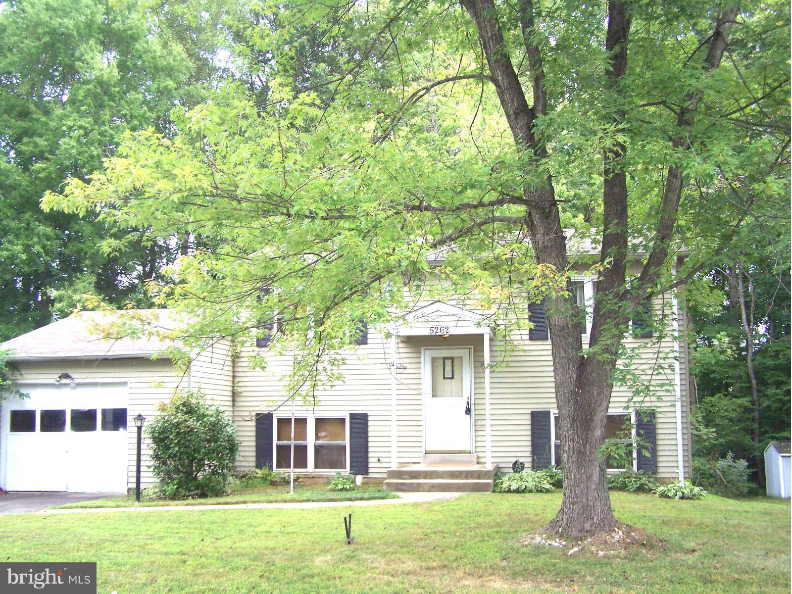 GREAT STARTER HOME ON QUIET STREET.....  This home features 3 bedrooms and 1 full and 2 half baths.  Large living room walks out to backyard.  Huge kitchen with plenty of dining space.  Separate family room off kitchen level. Deck and large backyard backs to trees.  Minutes to Quantico and Belvoir, Pentagon.  Commuter bus and lots close by.  Near shopping and dining.