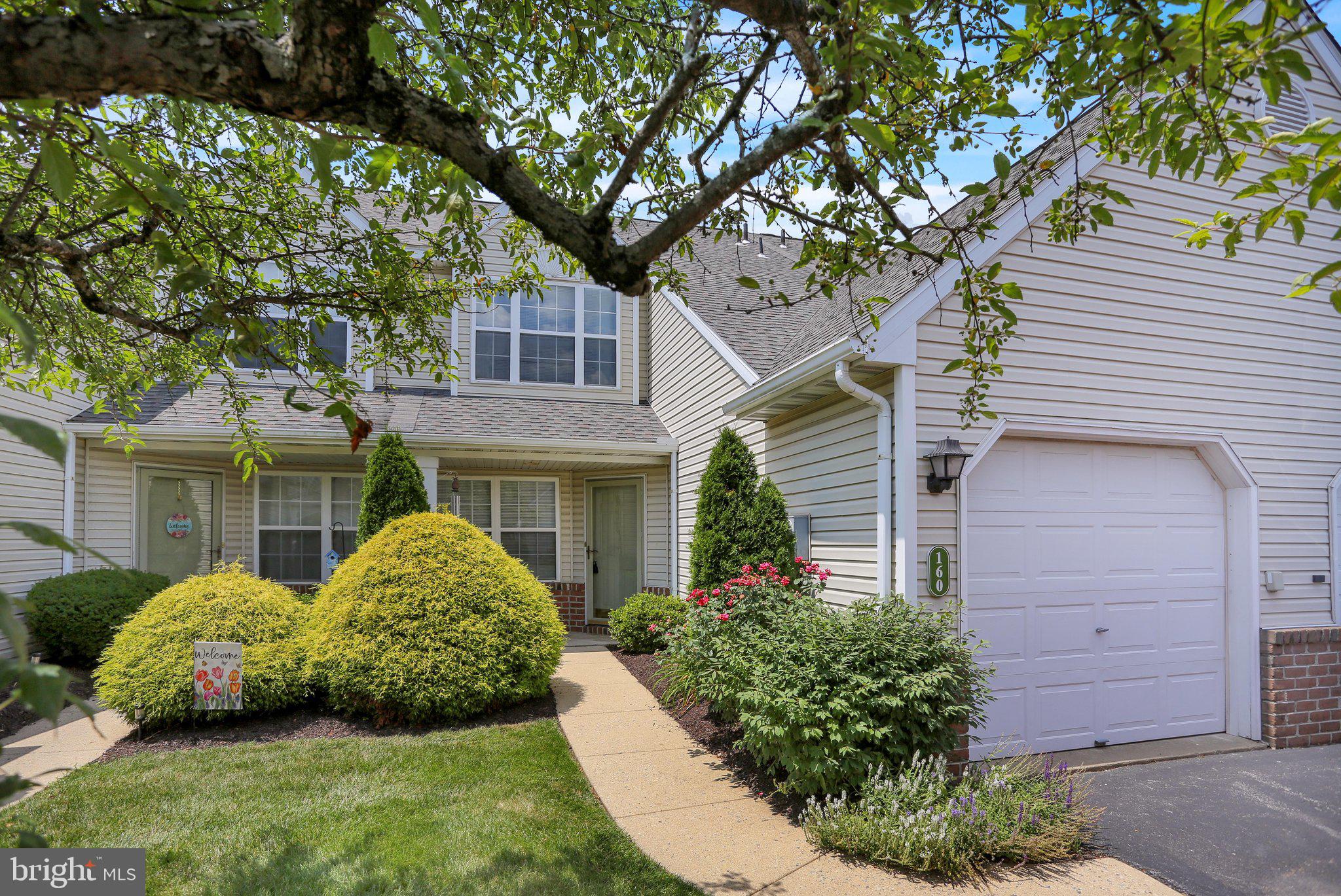 Welcome home to 160 Hickory Lane in Wilson School District! Tucked away in the lovely Spring Ridge community, this home offers a maintenance free lifestyle so you can focus on what's most important. Step inside to this 3 bedroom, 2 1/2 bath townhouse that is move in ready with plenty of natural light and a neutral color palette. This open 1st floor is inviting with a spacious living room, kitchen and dining area. The fireplace is a nice touch for entertaining or to keep you cozy while cooking or baking. Stepping outback from the sliding glass door, you can imagine summer evenings on your covered patio enjoying a glass of lemonade. The 1st floor conveniently offers a half bath and a laundry room. You'll love parking in your 1 car garage and keeping you car out of the elements! Upstairs, you'll fall in love with the primary suite. From the vaulted ceilings to the hardwood floors, a fantastic walk-in-closet and a private bathroom. Bedroom 2 and 3 are good sizes with great closet space and the additional full bath is just what your family needs and wants. The roof and the furnace were replaced around 2020! Call today for a private tour!