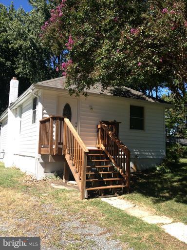 Cute 2 bedroom, 1 bath cottage with limited water view from exterior.  Large backyard and rear deck will make for enjoyable evenings spent outdoors.  No pets/no exceptions.