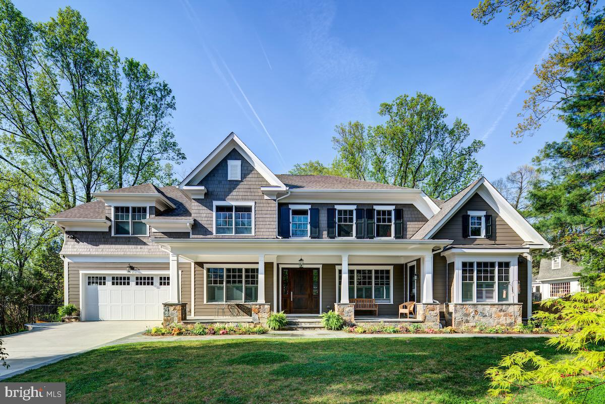 Custom  Built. Prime Location. Elite Schools. Nestled on a private half-acre behind Holton-Arms, Primary Day School, and within the coveted Walt Whitman cluster. This custom-built home offers expansive proportions, thoughtful design, and exceptional flexibility.
Built in 2016 and impeccably maintained, this exceptional residence is set apart by a rare private main-level apartment with its own separate entrance—perfect for extended family, long-term guests, a nanny, au pair, or as a seasonal home base. Thoughtfully designed for one-level living, this beautifully appointed suite feels like a luxury retreat, featuring a cozy fireplace, full-size kitchen, sunlit family room, spacious bedroom, skylights, and a private deck.
The main level features a chef’s kitchen, large open family room with gas fireplace, inviting sunroom with gas fireplace, living room, dining room, butler’s pantry, dedicated home office with garden views, and an additional office built into the kitchen. The mudroom entry from the garage is equally well designed, with heated floors, drop space, and a walk-in closet with built-in shoe cubbies.
The primary bedroom was thoughtfully designed with privacy and serenity in mind, offering peaceful views overlooking the gardens.
Three additional bedrooms, a dedicated craft room, a spacious laundry room, and a bonus lounge or study provide exceptional flexibility for reading, homework, relaxing, or everyday living.
The walk-out lower level is ideal for entertaining and enjoying the private yard, with a recreation room featuring a gas fireplace, refreshment center, screened porch, wall of French doors, yard access, and a private guest suite with separate entrance.
Additional highlights include  elevator-ready access to all three levels, exceptional storage, and a quiet cul-de-sac location near Holton-Arms with easy access to Virginia, Clara Barton Parkway, I-495, I-270, Potomac, downtown Bethesda, and Washington, DC.
Set on nearly half an acre, the private grounds offer beautiful wooded views from the sunroom, kitchen, family room, and screened porch. Just minutes from the C&O Canal, the Potomac, Cabin John Trail, and Great Falls Park, this is a rare opportunity to enjoy peace, privacy, nature, and convenience on Burdette Court. 
Available for private showings