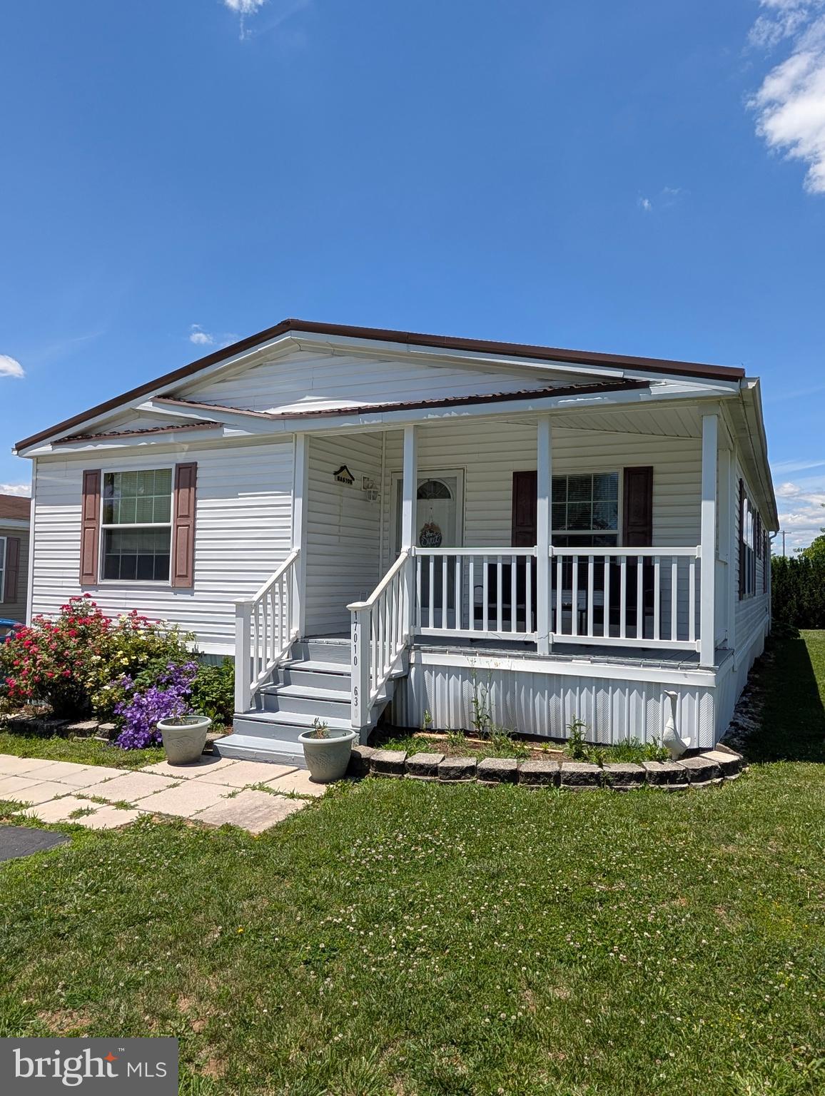 Welcome home to effortless one-level living in the desirable Lakeside community! This beautifully maintained manufactured home shines with fresh interior paint and stunning, newly updated flooring throughout. The spacious layout features 3 generously sized bedrooms and 2 full bathrooms, providing plenty of space for everyone. At the heart of the home is a bright country kitchen equipped with ample cabinets and counter space, flowing seamlessly into a separate dining area. Conveniently located just off the dining room, you will find a large, dedicated laundry room with extra storage potential. Step outside to enjoy your choice of front or back decks—perfect for morning coffee or evening relaxation. The exterior checklist is complete with a paved off-street parking pad, a patio picnic area for outdoor entertaining, and a handy storage shed for all your extras. Move-in ready and waiting for you!
