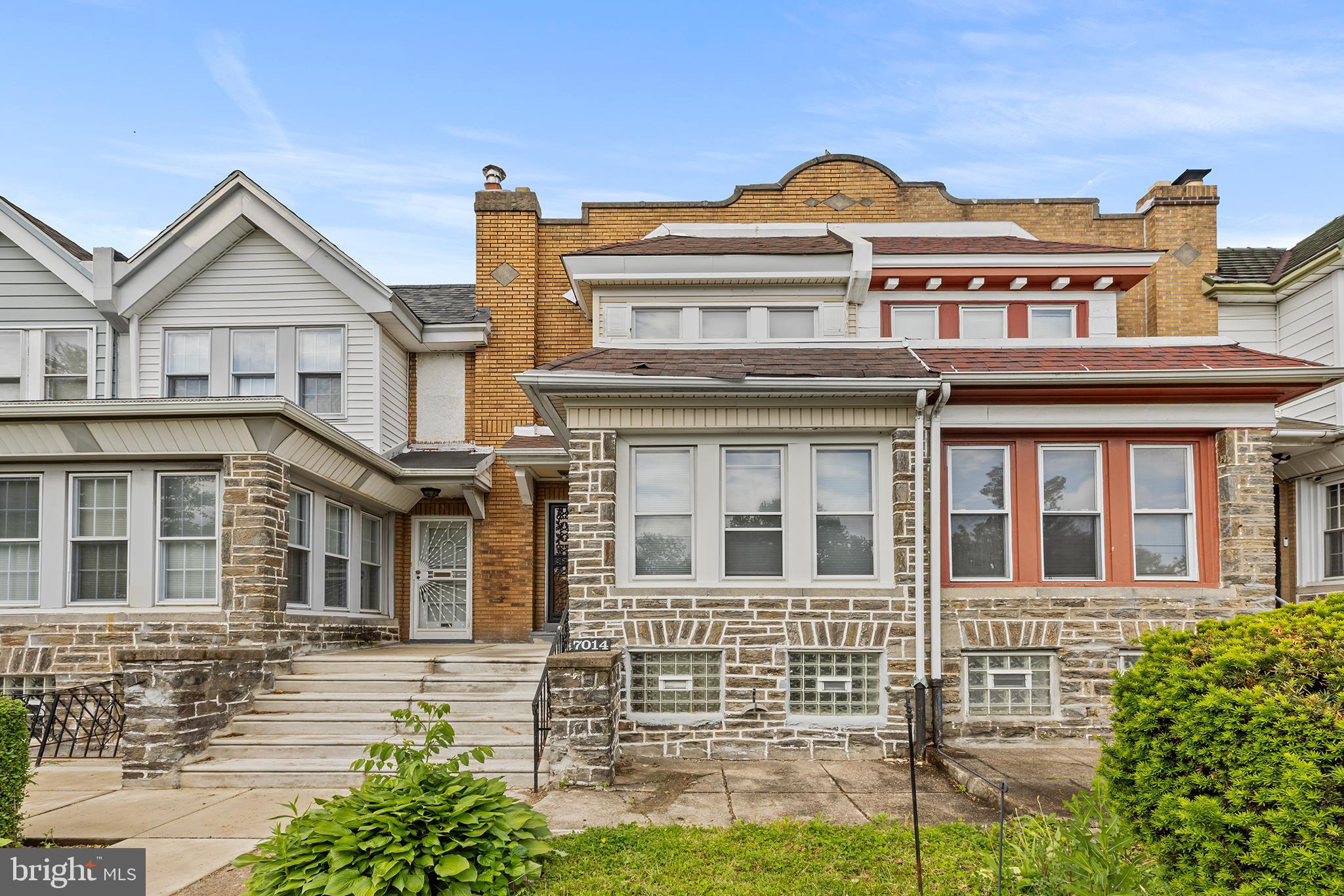 Welcome to 7014 Ogontz Avenue, a large 4-bedroom, 2 full bathroom row home in the West Oak Lane area of Northwest Philadelphia. This 1,400+ square foot house is well-maintained and ready for the new owner to move right in. The home gets a lot of natural light through the windows in the front porch area, and it features original hardwood floors, wood paneling, and a fireplace in the living room. Recent updates include a brand-new ceiling with recessed lights in the living and dining rooms this year, plus a new roof, new central air, an updated main electrical cable, and an updated kitchen all done about three years ago. The large walk-out basement is partially finished and includes a full bathroom that was also added three years ago. Outside, you get a front yard, a patio, and a backyard with a garage plus two extra parking spaces, which is very hard to find in this area. It is located on a great block close to highway ramps, shops, and public transit. Whether you’re a first-time homebuyer or an investor looking for your next opportunity, this property offers endless possibilities. Schedule your tour today. The house is being sold "as-is."