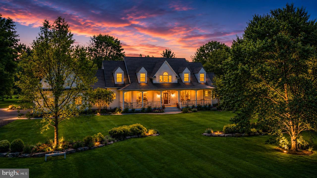 Beyond automatic gates and a winding drive lined with a young fruit orchard and more than 100 newly planted native trees, this extraordinary estate presents a rare opportunity to own a 6+ acre Bucks County farmstead. Enhancing the property's long-term potential, an approved variance permits the construction of a barn, creating opportunities for equestrian, agricultural, or recreational use.

Originally built by Zaveta Custom Homes and extensively reimagined by its current owners, the residence has been featured in House Beautiful and blends meticulous craftsmanship with vibrant, design-forward living. Inside, intentionally curated interiors balance timeless architecture with a modern sensibility. A dramatic navy-paneled staircase anchors the foyer, leading to sunlit living spaces. The beautifully updated kitchen features custom cabinetry, quartz countertops, dual sinks, premium appliances, instant hot water, and an integrated seltzer system, while a white-painted stone fireplace with a high-efficiency wood-burning insert serves as the focal point of the family room. The home offers two dedicated first-floor offices, a sizable mudroom with a full shower conveniently located off the pool area, a custom laundry room, and a luxurious first-floor primary retreat complete with a renovated spa bath, heated floors, soaking tub, zero-entry shower, and dual walk-in closets. Upstairs, flexible bedroom suites provide abundant space for family and guests, while the finished lower level delivers a world of recreation with a fitness studio, theater area, playroom, and hand-painted murals throughout.

Complementing the main residence is a fully finished guest apartment above the attached three-car garage, offering independent accommodations with a private bedroom, full bath, living area, and kitchenette. Every detail throughout the estate reflects a commitment to both beauty and functionality, creating spaces that adapt effortlessly to life's evolving needs.

The grounds are equally exceptional, designed as an immersive extension of the home itself. A covered front porch captures sunset views, while a screened sunroom overlooks the property's gardens, custom cedar greenhouse, and newly installed 20-by-40-foot heated gunite saltwater pool with French Grey plaster, automatic cover, LED lighting, and expansive Pennsylvania bluestone terraces. Raised garden beds, perennial plantings, a chicken coop, newly seeded native wildflower meadow, workshop, and equipment barn further enrich the landscape, creating a private sanctuary rooted in connection to the land.

Significant recent investments, including a new roof, HVAC systems, electrical panels, a whole-house generator, and numerous infrastructure upgrades, provide lasting peace of mind. Located within the New Hope-Solebury School District, the property is immersed in a setting of unparalleled privacy and natural beauty while remaining just moments from the village of Carversville, a local farm market, and scenic country roads, offering the best of both countryside seclusion and everyday accessibility.