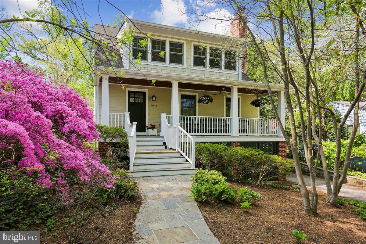 Offers due 4/22 at 1pm Welcome to 11012 Montrose Avenue, a fully renovated Craftsman home with a quintessential front porch in highly sought after Garrett Park. Nestled on an 8,374 square foot lot with blooming, colorful indigenous plantings, the property showcases pristine finishes and thoughtful design, including hardwood floors, elevated hardware, beadboard accents, custom built ins, refined wood trim, and replacement windows, including striking triple window sets. Seamlessly blending period charm with modern convenience, this home offers timeless appeal.

Step through the covered front porch with a tongue and groove ceiling into an inviting foyer that leads to the living spaces. The gracious living room features a wood burning fireplace, recessed lighting, and plantation shutters. The chef’s kitchen offers a professional grade Wolf gas range with six burners, a built in griddle, two ovens, and a stainless steel hood, along with granite counters, handsome cabinetry with glass front panels, a Bosch dishwasher, a pantry, a breakfast bar island with pendant lighting, ceramic tile backsplash, ample prep space, upgraded appliances, and a dedicated office nook with a skylight and backyard views. The kitchen opens to the large dining room, creating excellent space for entertaining. Just off the dining room is the rear stone patio overlooking the incredible yard. The main level is complete with a powder room, a mudroom with a built-in bench, and a coat closet.

The second level features a landing with a built-in bench, three generously sized bedrooms, and two well-appointed bathrooms. The primary suite includes wood floors, recessed lighting, two wall closets with organizing systems, custom wood blinds, and access to a private covered balcony overlooking the patio and yard. The sun filled primary bathroom has skylights, heated floors, a pedestal sink, and hexagon tile flooring.

The lower level offers flexible living space with a recreation room boasting new luxury vinyl flooring, recessed lighting, and display shelving, along with an entry area, laundry room, and storage. A separate entrance from the driveway leads to a practical drop zone, ideal for sports equipment and everyday use.

Outside, the private fenced backyard is filled with mature plantings, including vibrant azaleas that attract admiration each season. A stone patio enhances the outdoor space, and driveway parking adds convenience.

Nestled within the Town of Garrett Park, the property enjoys the town’s close-knit community and independent spirit, along with its own post office, swimming pool, and the Black Market Bistro. Conveniently located just blocks from the MARC train, Rock Creek Park, Strathmore Music Hall, Grosvenor Metro, and the new North Bethesda Shops.