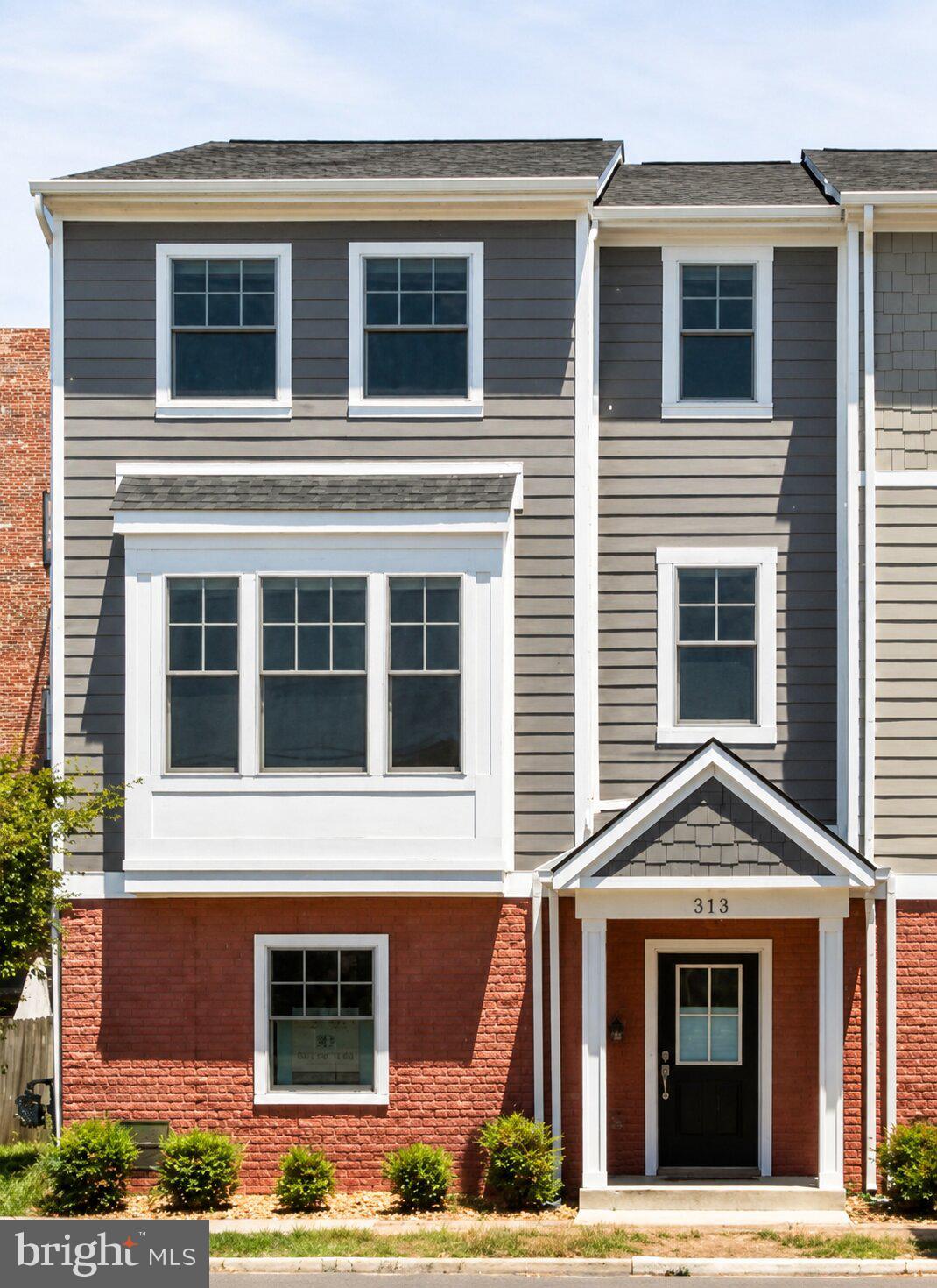Welcome to 313 Charles St, at 2354 sq. ft. of living space, this beautifully maintained 3-level attached row home in the heart of downtown Fredericksburg offering modern finishes, everyday convenience, and an unbeatable walkable location. Built in 2022, this home features an open main living area with LVP flooring, a comfortable family room with gas fireplace, and a bright gourmet kitchen designed for both function and gathering. The kitchen includes stunning quartz countertops, white cabinetry, stainless steel GE Profile appliances, gas cooking, an island, table space, backsplash, pantry, and a sliding glass door leading to the composite deck.

The upper level offers three bedrooms, including the owner’s suite with a private bath featuring heated floors, double sinks, and a full tiled walk-in shower. Two additional bedrooms share a Jack-and-Jill bath with double sinks and a tub/shower combination. The entry level adds valuable flexibility with a recreation room that can also serve as a home office or optional 4th bedroom NTC, plus a convenient half bath.

Additional highlights include Pella windows, Hardi-plank siding, a 30-year roof, poured concrete ground-level walls, upper-level laundry with washer and dryer conveying, and an attached 2-car garage—an incredible feature for downtown living. Enjoy a prime location just minutes from downtown Fredericksburg shops, restaurants, and the VRE, with residential parking permit availability for additional downtown parking convenience. This home offers the perfect blend of like new construction, low-maintenance living, and walkable city access. Some photos have been virtually staged to help illustrate the potential use and layout of the spaces