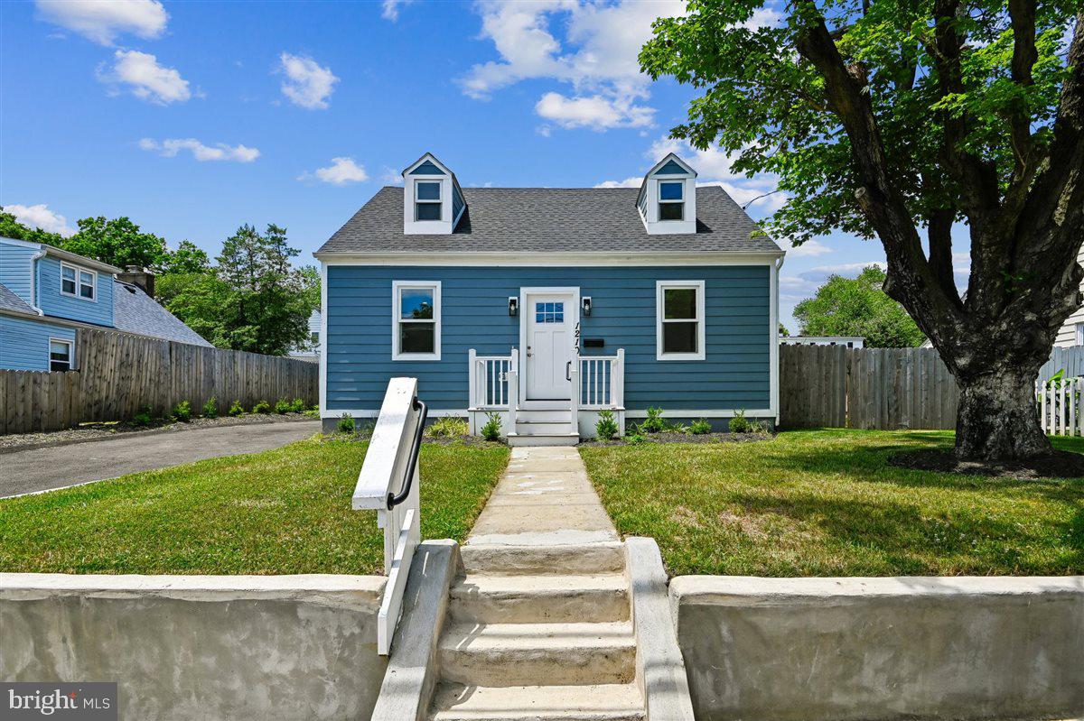 Welcome home to this thoughtfully redesigned home in Eastport just blocks from Spa Creek and minutes to downtown Annapolis. This beautifully updated 3-bedroom, 3-bath residence offers approximately 1,600 finished square feet across two levels, combining a functional layout with quality finishes and extensive upgrades throughout.
The main level features a bright living room and an updated kitchen with quartz countertops, shaker cabinetry, stainless steel appliances, and a dining area. A main-level bedroom and full bath provide flexibility for guests or a home office. A dedicated laundry and utility space leads to the rear addition, where the private primary suite includes vaulted ceilings, a walk-in closet, and an en-suite bath with double vanities, custom tile, and a walk-in shower.
The upper level offers a finished attic suite with a third bedroom, full bath, and bonus flex space suitable for an office or additional living area. Interior features include durable flooring, recessed lighting, and a cohesive, modern design.
Exterior highlights include a fully fenced backyard with new sod and a concrete patio, ideal for outdoor enjoyment. The property also features professional landscaping, a new asphalt driveway for off-street parking, and durable exterior materials including Hardie Plank siding, Andersen 200 Series windows, and a new architectural shingle roof.
Major system upgrades include 200-amp electric service, new plumbing, dual-zone HVAC, and a whole-house sprinkler system. Conveniently located near restaurants, marinas, parks, downtown Annapolis, and Truxton Park.