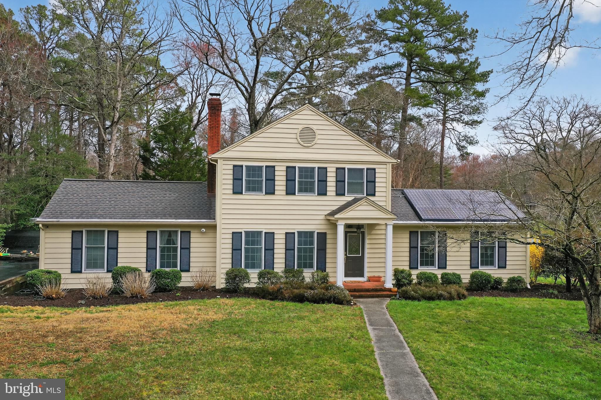 Spacious 3-4BR/2.5BA contemporary colonial on a large corner, culdesac lot in Deer Harbour. Custom-built home with original hardwood floors, crown-, chair-rail, and picture-frame-mouldings, features many big-ticket updates inside and out, and an oversized 2-car detached garage with a 2nd floor walk-up loft. Welcoming foyer flanked by large formal living room - hardwood floors, exposed beams, wood-burning fireplace, and expansive family room - hardwood floors, tons of sunlight. Dreamy kitchen, designed for the home chef - tons of counterspace and cabinetry, including an island with an extra sink and electric, ample recessed lighting - wide open to the breakfast nook and step-down to the sunroom with lush views of your yard. Formal dining room w/hardwood floors, crown- and chair-rail, picture-frame mouldings. Off the living room is a great surprise - a smart and space-saving built-in 'hall office' with nice-sized desk and lots of cabinetry leading to a flex room with hardwood floors and closet -- your 1st floor guest bedroom? -- study? -- den? An updated half bath, and huge laundry room w/utility sink + loads of storage completes the first floor. Upstairs, the primary bedroom - wood floors, walk-in closet, attached bath w/new vanity, lighted mirror. 2 additional bedrooms with wood floors. 2nd full bath with tub/shower combo. Roomy hall closets + pull-down stairs to the attic for more storage. Detached garage with so much potential - permanent stairs to the floored 2nd floor. Upgrades by the current owner include - architectural shingled roof, multi-zoned HVAC system -- propane gas on the 1st floor, electric heat upstairs, bathrooms, paint, flooring in kitchen, foyer, sunroom, and hallway. * * * $$$AVE money with solar-energy -- panels by Tesla, that the seller will pay off at settlement - which  has saved them hundreds of dollars a month in their electric bill. * * * Delightful yard with room to roam - patio space, mature landscaping + trees, and room for gardens. Deer Harbour offers a generous community recreational area - tennis courts, picnic areas, playground, golf course, trimmed with trees. Great location - minutes to Rt 50 Bypass, North Salisbury or Downtown Salisbury,  the University or the Hospital campuses -- yet with a comfortable,  established neighborhood feel -- winding streets lined with handsome homes of all styles, and trees galore. Don't miss this rare opportunity to live in one of Salisbury's most beloved communities! Sizes, taxes, distances approximate