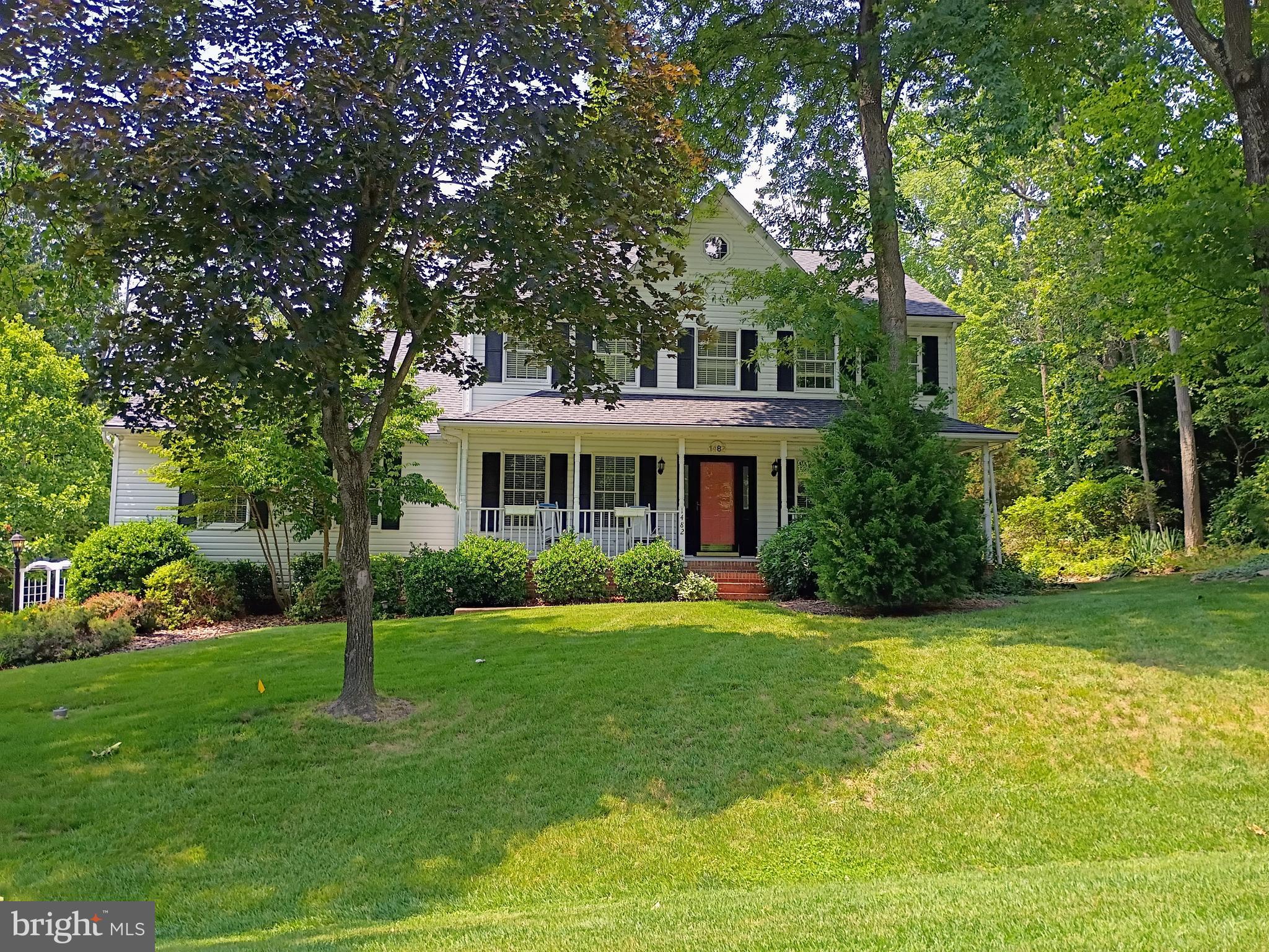 Set on a breathtaking .81-acre lot backing to peaceful woods, this quality-built Colonial offers exceptional space, privacy, and endless potential. Surrounded by mature landscaping in a picturesque community, the home features over 3,000 finished square feet above grade, plus an additional 1,909 square feet in the expansive unfinished lower level.
Designed with generous room sizes and a timeless floor plan, the main level is ideal for both everyday living and entertaining. The spacious kitchen, complete with a center island and dining area, opens to the dramatic family room featuring a vaulted ceiling, wood-burning fireplace, skylights, and a triple atrium door leading to the sizable deck overlooking the beautifully landscaped backyard. The formal living and dining rooms showcase hardwood flooring and elegant crown molding. A versatile main-level bedroom or office, also accented with hardwood floors and crown molding, adjoins a full bath that is conveniently accessible from both the room and the foyer.
Upstairs, three generously sized bedrooms provide comfortable accommodations. The primary suite features hardwood flooring, a walk-in closet, and a large private bath with a soaking tub, walk-in shower, dual vanities, and abundant room to create a luxurious retreat. A second full bath serves the additional bedrooms.
Recent updates include a new roof and hot water heater (2022), skylights (2016), and HVAC system (2018). The attached side-entry two-car garage offers valuable workshop space for hobbies, projects, or extra storage.
The unfinished lower level provides outstanding potential for future living space, whether envisioned as a recreation room, home gym, media center, guest suite, or all of the above. Outside, an irrigation system helps maintain the lush grounds, where mature trees, colorful plantings, and a serene wooded backdrop create a private oasis. The fantastic location enables residents to walk to the local AACPS school campus, ride bikes to Downs Park on the Chesapeake Bay and easily commute to Ft. Meade, Baltimore & Annapolis. Multiple marinas and favorite local restaurants are within just a couple of miles.  
While cosmetic updates will allow the next owner to add their own style and vision, the home's solid craftsmanship, desirable layout, and extraordinary setting provide an exceptional foundation for creating a truly remarkable residence. Schedule a tour today and experience everything peninsula life has to offer!