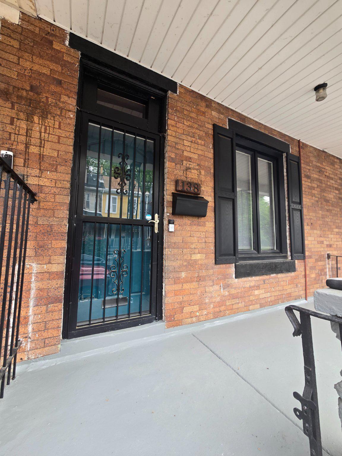 Welcome home to 138 E Pleasant Street!  This recently renovated home offers hardwood floors, fresh paint, modern details, and nearly every major home mechanical recently replaced or upgraded!  No worries for years to come!  This is not a flip - this home has been cared for by the homeowner for the last five years, including new hall bath and plumbing, new roof (2026), new ac and heater (2025), new water heater (2024), and everything else in the home is 5 years old or less.  The entire property was painted just before listing.  Enter this brick rowhome from your freshly painted front porch, into your bright modern living room, featuring hardwood floor, modern open shelving, and electric fireplace with mantel.  From the living room, enter the dining room which features 3 large windows, and an upgraded climate control thermostat.  The entrance to the basement, with washer and dryer is in this room.  The kitchen is large, with stainless appliances (refrigerator, gas stove, microwave, and dishwasher), and features multiple windows, island, built in shelves, and a corner bench with storage.  Upstairs there are three bedrooms - the rear bedroom features exposed brick and its own ensuite bath with shower.  The hall bath features a tub shower and all new plumbing.  In the middle is a smaller bedroom, which could also be an office or spacious closet.  In the front of the house, the bedroom offers a large closet and 3 large windows.  Move into your new worry-free home before the summer is over!