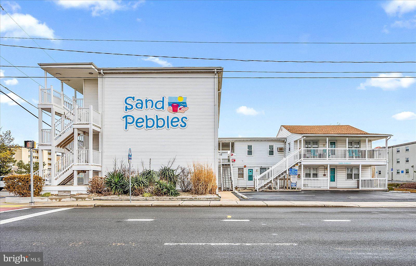 Is it time to purchase a beach getaway or are you looking for an affordable real estate investment? Spring will be here before you know it. Here is a one bedroom, 1 ½ bath condominium on the sought-after oceanside of Coastal Highway. It cannot be understated that seeing a property that has been completely repainted with a neutral, light & bright color is a huge PLUS! What else does every buyer want - a property that has been completely renovated and updated. Check & Check! This condominium now has a luxurious, contemporary feel with all the new materials used. Here is the list: flooring & lighting throughout; bathroom tile & fixtures; stainless-steel appliances, kitchen fixtures, beautiful granite & backsplash. Another checklist item: outdoor space for fresh air, dining, entertaining & relaxing. Check #3! There is a spacious, covered breezeway & balcony that is private for this unit only. It is so large there is room for a dining table with several chairs right outside the door where you can look west at the sunset sky. Then there is the balcony end where you can put a loveseat or rockers w/ a table OR choose a high-top table with 2-4 chairs and enjoy your favorite morning beverage watching the sunrise sky & listening to the ocean waves. A Final & ever-important checklist item here at the Beach is The Location. Check #4! First & foremost is usually how close to the beautiful beach & ocean: Sand Pebbles condominiums are on the oceanside, so it is a short walk! As for what else the town offers, it is a great location midtown on Coastal Highway. Being at 64th Street, take a really short to short walk to groceries, sundries, breakfast, bars/restaurants, miniature golf & much more! More Location news: the Ocean City Beach Bus has a stop right outside the building North bound & 1 block north across the street is a South bound stop. You can get a cheap 1-day pass & there is a free downloadable app. Some photos contain virtual staging. This condo is vacant, so it is easy to see. Set up your appointment to come see it in person. Remember Life is Not a Dress Rehearsal, Own at The Beach!