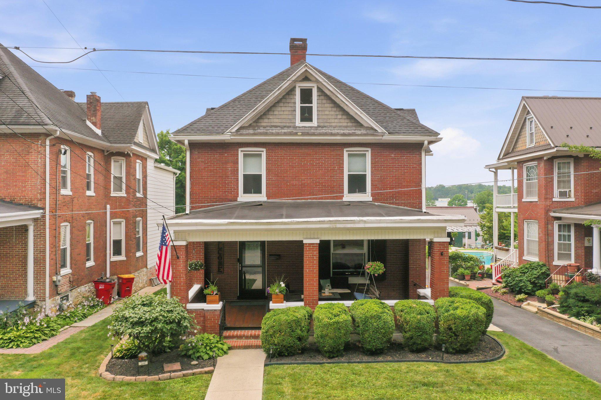 Turn of the century American Foursquare that has retained much of its historic character after more than a century! This beautiful early 1900s brick home features original hardwood floors, original pocket door hardware and tracks, original woodwork throughout, original chimney and fireplace, original service staircase, sleeping porch on second floor, 9 foot ceilings, large windows, and a walk-up attic. The full width large welcoming front porch is a homeowner’s dream!