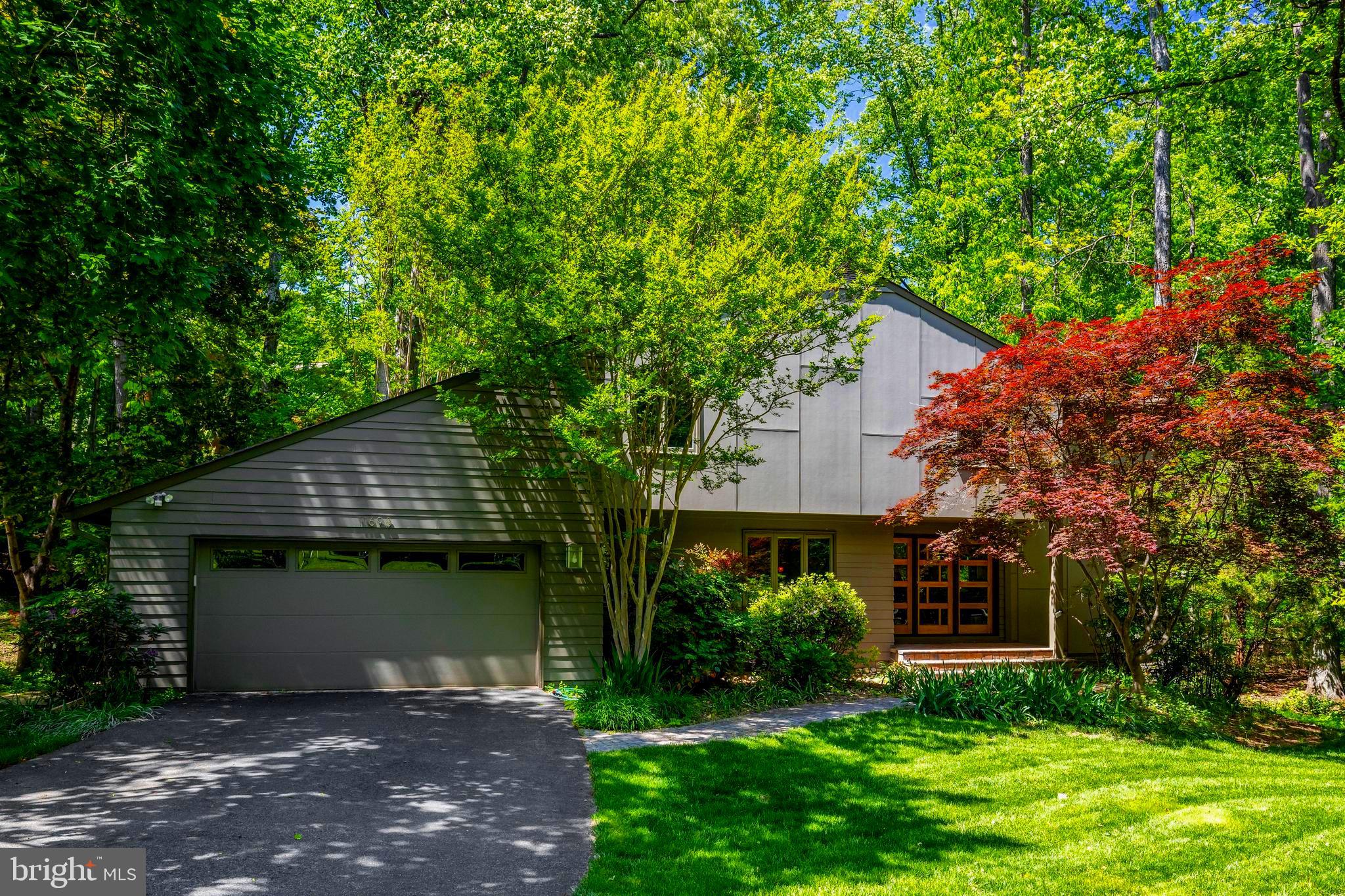 Stunning Contemporary Hardieplank home in the most incredible park-like setting including extensive hardscape and gardens! The owners have lovingly updated and cared for this home with beautiful upgrades, additions, custom windows & skylights, maple hardwood floors, and beautiful lighting. The hand-crafted cherry & padauk handrail on their staircase is truly a piece of art! As you enter the breath-taking custom Kolbe front door, you are greeted in the large foyer. The expansive main level offers a Living Room, Dining Room, Family Room with wood burning stove, Sun Room, Gourmet Kitchen, Laundry Room with custom pantry, and Powder Room. The showcase Kitchen has gorgeous Quartzite counters plus a live edge walnut breakfast bar, stainless Bosch oven & microwave-drawer, Sub-zero Refrigerator, Miele 3-tiered dishwasher, and Plato cabinets! The upper level includes the Primary Bedroom with balcony, Primary Sitting Room, custom designed Primary Bathroom with walk-in shower, 2 additional generous size Bedrooms, Study, & updated second Bathroom. All bedrooms have lots of closets including an easy-access door to a floored storage space. The lower level is quite spacious with 3 large Recreation Rooms, a gas fireplace, spa-like Bathroom, and a well-designed utility room including a workshop, handy utility sink & cabinet, and a tankless water heater. The yard is so inviting with gorgeous curved stone walls, stone walkways, year-round low-maintenance perennial gardens, patios, decks, porch & balcony, AND a private grassy oasis in the backyard for running around or sitting by a firepit! The schools are top notch with Waples Mill ES, Franklin MS, and Oakton HS! And a membership to the Oakton Swim & Racquet Club can be purchased directly from the owners as a separate bill of sale. This home truly brings the outside, in! You Will Fall in Love!!