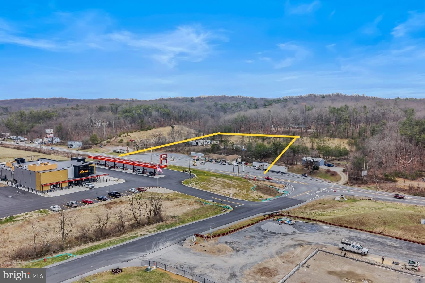 GREAT BUSINESS LOCATION  -  Explore the endless possibilities of  building your own fast food restaurant, or other business!  Located along busy US Route 522 in Berkeley Springs.   Situated in a fast growing commercial location.  This property features A 3100+ square foot building featuring multiple rooms, commercial kitchen, walk in cooler, walk in freezer, 3 restrooms, oil hot water baseboard heat, central ac, PUBLIC WATER & SEWER!  Property is 2.75 acres.
