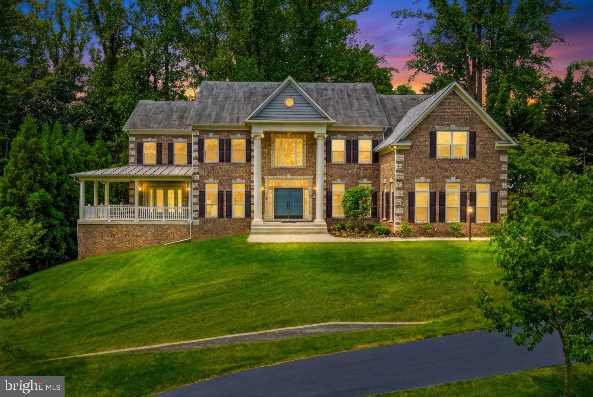 Where hilltop serenity meets urban-luxury living , 9,046 sq ft of like-new, semi-custom perfection in McLean's most coveted corridor

9,046 finished sq ft | 7 Ensuite bedrooms | 3 Finished levels | 2019 Built (semi-custom) | ½ acre private hilltop lot | Move in ready with annual maintenance fully paid |

Imagine waking up to birdsong and absolute stillness , then arriving at DC in under twenty minutes or go shopping at Tysons in under five minutes. Privately perched atop a half-acre hilltop on a quiet cul-de-sac, this expanded 2019 semi-custom residence was conceived beyond the builder's standard plan, with every room scaled for the way families actually live: generously, graciously, and without compromise.

Morning light pours through 10-foot-plus ceilings and two-story volumes as the home is North-East facing, illuminating a gourmet kitchen anchored by two large islands, the natural gathering place before the school run, the weekend brunch, the impromptu dinner party that spills into the two-story family room beside a flickering gas fireplace. A walk-in pantry, bar with beverage fridge, and casual dining area mean the kitchen works as hard as it is beautiful. A sunroom opens to the front porch for quiet afternoon coffee, while a main-level ensuite guest room, equally ideal for multigenerational living or a live-in au-pair, keeps every household seamlessly accommodated.

Upstairs, the primary suite is a sanctuary unto itself: a dedicated sitting room, an enormous walk-in closet, and a spa-caliber bath with a deep soaking tub and separate expanded shower. Four additional ensuite bedrooms, each with oversized walk-in closets, complete the upper level , along with upper-level laundry. The walk-out lower level delivers a full recreation area, dedicated home theater, kitchenette, a serious gym room, and a seventh ensuite bedroom, a self-contained retreat for guests, extended family, or entertainment.

The infrastructure matches the vision: an oversized 3-car garage with EV charging, a whole-home 26kW Generac generator, a prepaid first-year HVAC service contract, a 10-station irrigation system, smart-home lighting, perimeter CCTV, and a monitored security system. Move-in ready, zero deferred maintenance, truly turnkey from day one.

The location is equally rare. Zoned to the prestigious Spring Hill → Cooper → Langley pyramid (Fairfax County Public Schools), with the assigned elementary under one mile away. The county-run Spring Hill Recreation Center, an indoor pool with 150+ weekly aquatics classes, fitness center, track, courts, and studios, sits moments from the front door. I-495, the Dulles Toll Road, the GW Parkway, and the Silver Line Metro deliver DC and Tysons with ease; Dulles and Reagan National airports are both nearby. Tysons Galleria and Tysons Corner Center offer luxury retail, fine dining, and premium grocery. For the soul: McLean's Alden Theatre, Wolf Trap, Capital One Hall, and DC's Kennedy Center and Smithsonian are a short drive; Great Falls Park and Scott's Run Nature Preserve keep the outdoors close.

Langley pyramid | Tysons Shopping Access | 26kW Generac Whole Home Generator | EV charging | Smart-home lighting | Spring Hill Rec Center nearby | Silver Line Metro | Great Falls Park | Monitored security + CCTV

Estate-quiet living. Urban-luxury access. FCPS top school district that opens doors. This is the McLean address discerning families and savvy investors recognize, and rarely get the chance to claim. Schedule your private showing today!