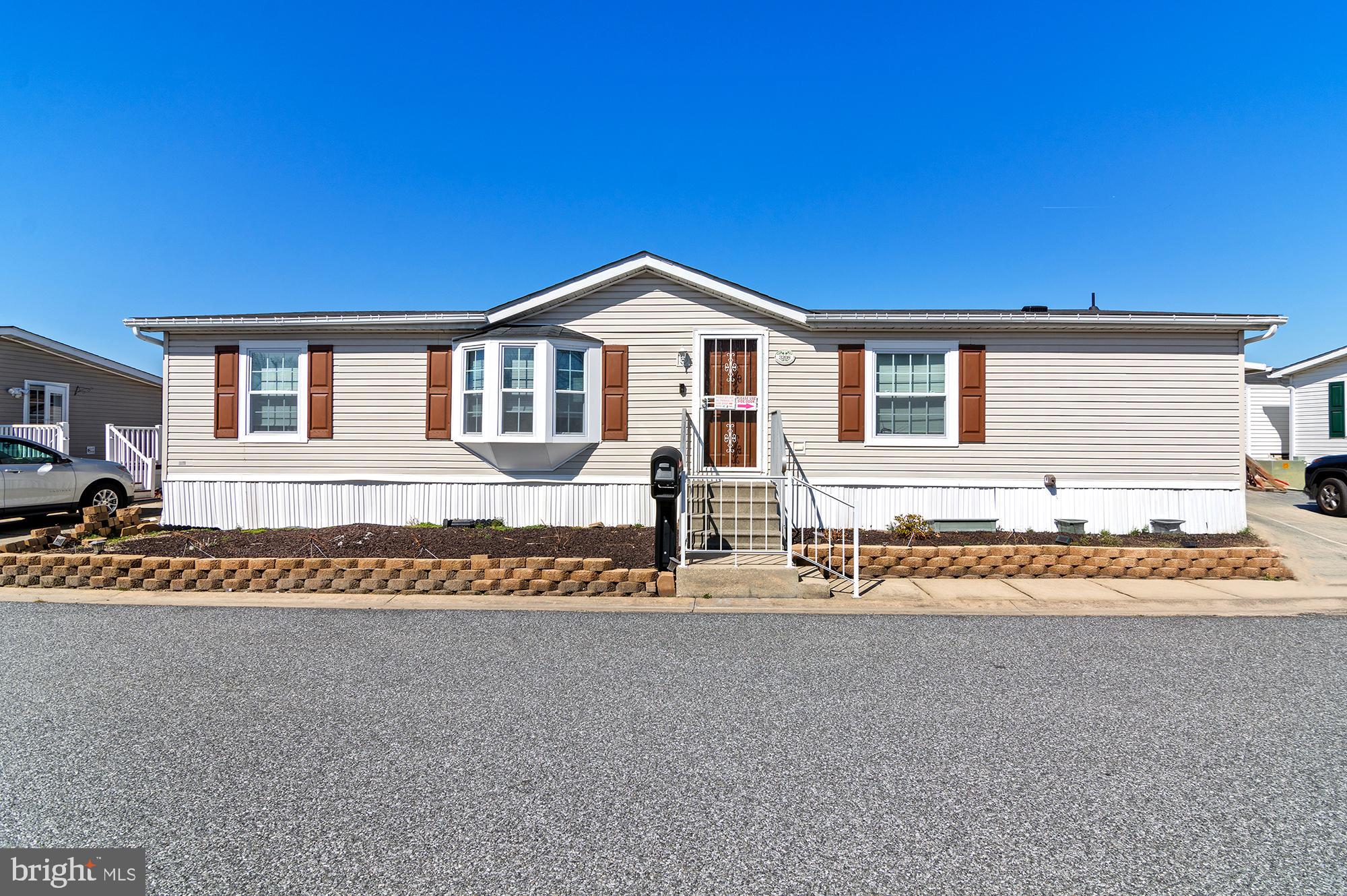 Just Listed!  Spacious mobile home in Peppermint Woods Community!  Loaded with upgrades and improvements!  Vaulted ceilings, laminate floors, large room sizes, open kitchen and much more!  Wrap around deck with wheelchair ramp.  Storage shed in rear yard.  New Roof - 2021; New Windows - August 2024; New AC - August 2024; New Countertops; New Dishwasher - Never been used.  Buyers must be approved by park.  Homes have been selling fast - make your appointment today!