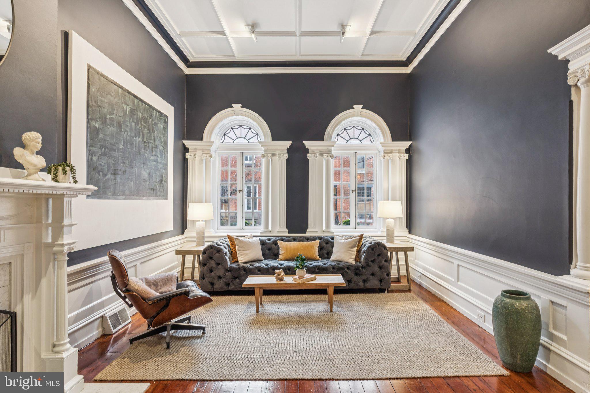 Set gracefully between the Rittenhouse Square and Fitler Square neighborhoods—on one of Center City’s most beloved, tree-lined residential streets—this stately historic townhouse blends timeless architectural grandeur with thoughtful, contemporary livability. Just steps from both Rittenhouse and Fitler Squares and within the highly regarded Greenfield School catchment, the home enjoys a serene, residential setting surrounded by classic brick and stone facades, all while being moments from the vibrant energy of downtown Philadelphia.

A gracious entry hall sets the tone, revealing high ceilings, original hardwood floors, detailed millwork, and tall windows that bathe each room in soft, natural light. The formal living and dining rooms retain the home’s historic scale and presence, offering elegant proportions for both daily living and memorable entertaining. Just beyond, a serving kitchen—distinct from the dining room—features granite countertops, sleek stainless-steel appliances, and wine refrigeration, while the dining room itself showcases leaded-glass windows, high ceilings, ornamental mantel, and crown moulding, preserving the traditional townhouse flow and architectural integrity.

On the garden level, a second, grand chef’s kitchen serves as a more casual gathering space and opens directly to the private rear garden—a rare and coveted indoor–outdoor connection in this neighborhood. A conveniently located powder room makes this floor ideal for relaxed hosting, weekend cooking, and everyday comfort.

The second floor features the primary bedroom suite at the front, complemented by a versatile rear room—perfect as a den, library, office, or sitting room—complete with a working fireplace, decorative mantel and easy access to a powder room on the same level. The home’s thoughtful layout allows these rooms to adapt beautifully to evolving needs.

The third floor offers two additional well-proportioned bedrooms, each with excellent light and storage, along with a full bathroom. At the top of the home, the fourth bedroom with an en-suite bath opens directly to a roof deck with exceptional skyline views—an inspired setting for morning coffee, quiet evenings, or fresh air above the treetops. A partially finished basement houses mechanicals and provides added storage and utility space.

Perfectly positioned in one of the most connected areas of Center City, this address offers exceptional access to every convenience. The University of Pennsylvania, Drexel University, CHOP, HUP, and Amtrak’s 30th Street Station are all nearby, as are the Schuylkill River Trail, parks, cafés, and an abundance of dining and shopping destinations such as Southgate, Ambrosia, Parc, and The Dandelion. With its outstanding access to public transit, bike routes, and pedestrian-friendly streets, the neighborhood makes getting around easy and enjoyable for all.

Elegant, warm, and deeply rooted in the architectural fabric of Center City, this home offers both presence and practicality—historic detail paired with the ability to live comfortably and beautifully every day.