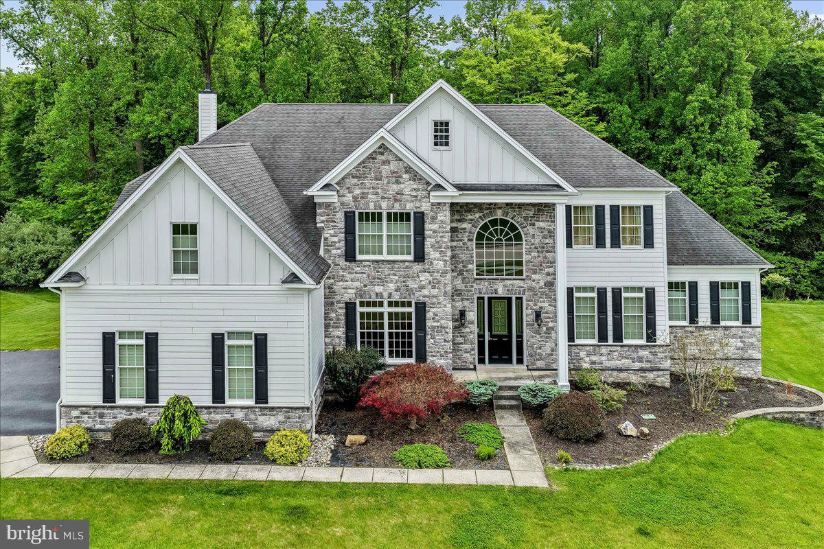 Highly Sought After Estates At Chadds Ford. Elegant Stone Colonial on Premium Lot that backs up to Open Space. 5 Bedroom 4.5 Baths. Enter the 2-Story Foyer with Curved Staircase, Elegant Living Room, Convenient Dining Room Adjacent to Kitchen Making Entertaining Easy, Gourmet Kitchen with Granite Countertops and Stainless Steel Appliances, 2-Story Family Room with Wall of Windows and Gas Fireplace, Convenient Study, Laundry Room and Powder Room. First Floor In-Law-Suite with Bedroom and Full Bathroom. Upstairs – Large Primary Suite with Sitting Room, Large Custom Closet and Elegant Primary Bath with Jacuzzi Tub with Adjacent Sinks and Shower. Second Bedroom with Ensuite, Third and Fourth Bedroom with Shared Bath. The Back Yard Area is Amazing with Tri-Level Deck, Screened Porch and Gazebo. The Yard backs up to Wooded Open Space which is very Rare in this Community. Full Walk-Out Basement, 3 Car Oversized Garage with Driveway Parking. This Home Is A Must See. Conveniently located just moments away from Delaware Tax Free Shopping Centers, Dining Options, Recreational Parks, & Renowned Schools.