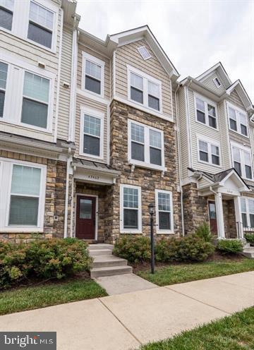 Beautiful interior townhome in top shape. Highly sought-after community of Brambleton! This 2 car garage home is well appointed with upgrades throughout. Beautiful kitchen with custom backsplash, stainless steel appliances, gas cooktop with custom hood, and double wall oven! Off of the kitchen is a large deck - perfect for entertaining. The owner's suite upstairs is light-filled with a tray ceiling! 2 secondary bedrooms with secondary bath. Rear load 2 car garage and ample street parking. HOA amenities include high speed internet, and basic cable TV paid by the owner. 5 pools and walking trails Do not miss this opportunity! Check this home out today!