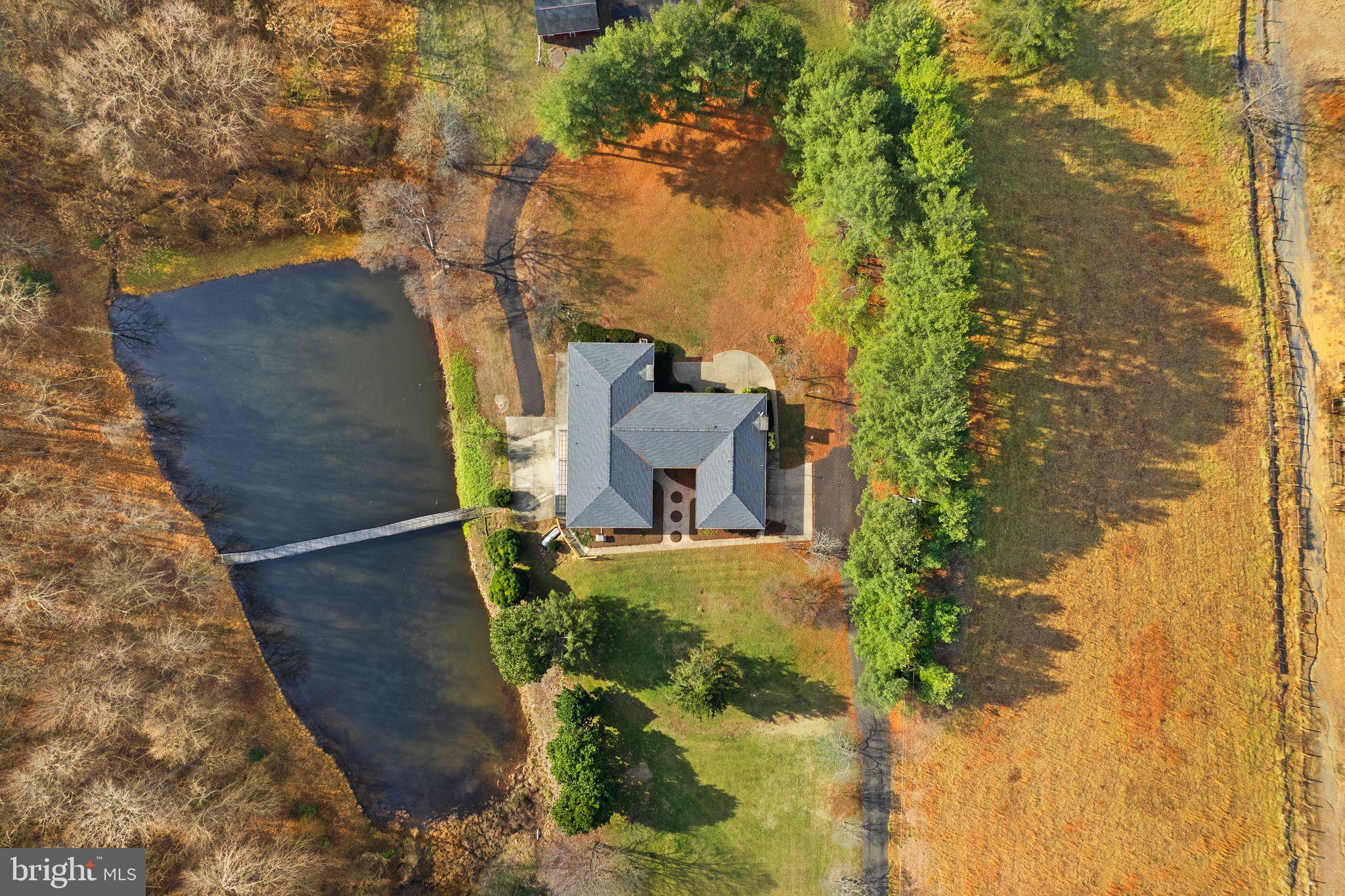 An incredible 11.4-acre estate with spectacular mountain views, with its own pond, in the beautiful Rappahannock County. Ideal for farming, homesteading, equestrian, recreation, or just as a private estate. No HOA. High-speed internet is already wired and ready to be active.

Recent improvements provide peace of mind, including Roof (2019), Water Heater (2022), Kohler Backup Generator (2023), Septic service completed (2023), Chimney inspected (2023), Lower‑Level W/D (2024), Certified Oil Tank inspected (2025), A/C unit and furnace (2026). Owned propane tank.

The residence is thoughtfully designed with multiple independent living areas, making it well-suited for multigenerational living, extended family arrangements, or potential income production. The home features the main-level areas of vintage European‑inspired elegance with solid oak floors throughout, Italian tile, two fireplaces, all in an expansive space with its own full kitchen and laundry room, 5 large BR/3 full BA. While the lower level offers a renovated living area, including a gigantic bonus room 46ft x 25ft, in addition to an oversized storage room, all with a 2nd full kitchen, its own laundry room, 2 large BR/1 full handicap accessible BA, its own entrance and parking pad. Space to add more rooms!

Outdoor amenities elevate the property's appeal: fish-stocked pond, established garden area, and a multi‑purpose barn/garage/shed ideal for vehicles, workshop or tools, storage.

Just 15min away from the Warrenton, Route 29 corridor, and the thriving Clevenger's Corner area. Also nearby is a world-class dining in Little Washington, the artistic charm of Sperryville, and the natural wonders of Shenandoah National Park; the best of the region is at your doorstep. From local wineries and craft breweries to premier golf courses, recreation is endless—all while remaining a manageable 90-minute drive from the heart of Washington, D.C.

Perfectly situated along the Rappahannock-Culpeper county boundary, this expansive property offers a rare opportunity to own a serene piece of Virginia’s most desirable countryside. 

This is more than just a private oasis; it is a strategic investment with genuine income potential in a high-demand rural market. Secure your future with a property that offers the perfect balance of seclusion, connection, space, and accessibility.