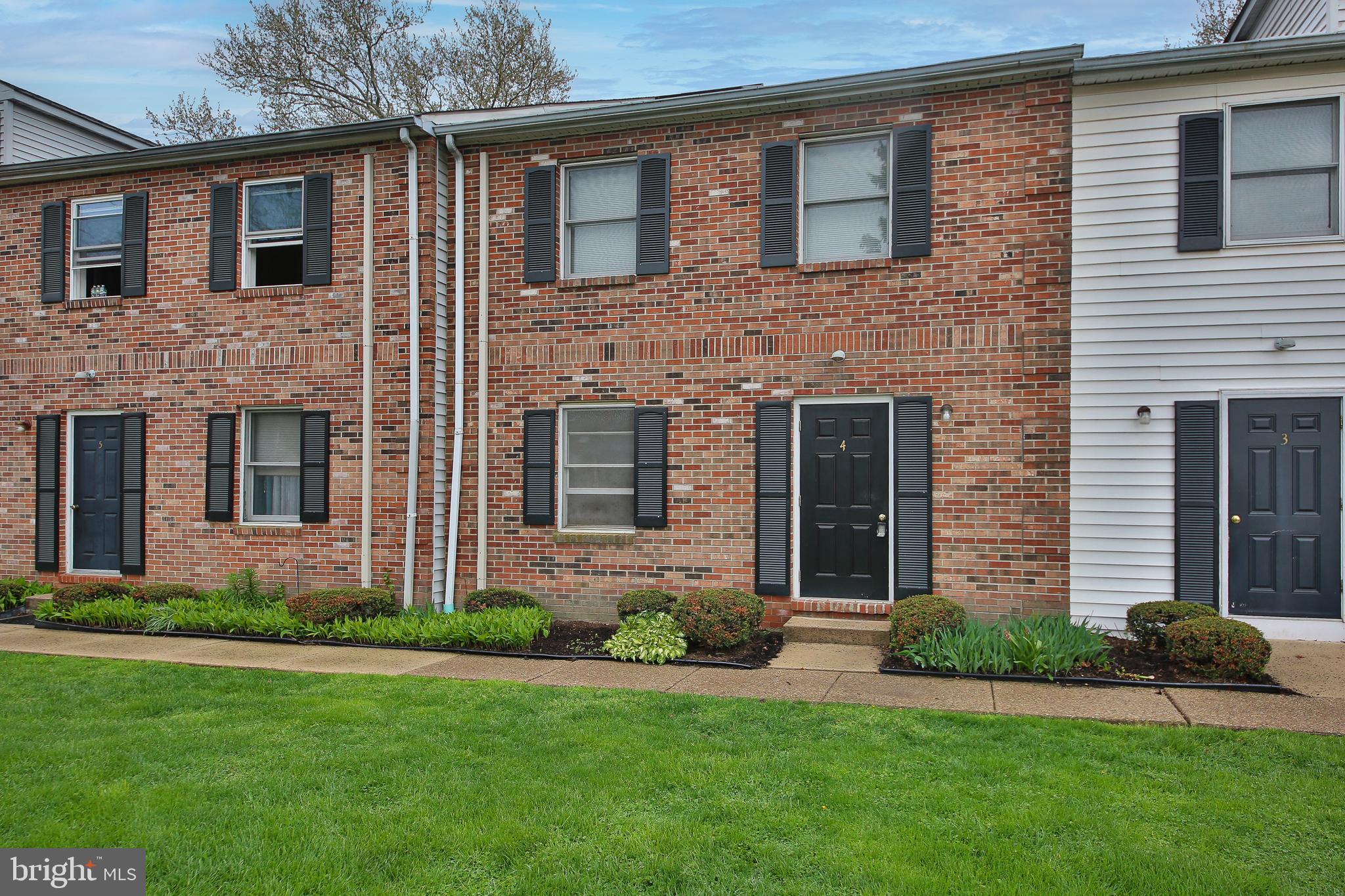 DO NOT MISS this single story 2 bed 1 bath townhome in the North Penn School District. The first thing you'll notice about the neighborhood is the "off the beaten path" feel when you first arrive; this is a very small condo association (around 15 homes) and its nestled into a no outlet back area of Lansdale, giving the grounds a very comfortable, private feel. Walking in through the front door of house #4, you are greeted by a large sunny living room with hardwood floors and ceiling fan. After glancing in the coat closet, you immediately notice the open floor plan whereby the living room flows into the dining room and kitchen area.  The dining area has the same hardwood, chandelier, and chair molding. The kitchen has stainless steel appliances and plenty of newly refinished cabinets. Walking towards the back of the house you come upon a bright and well maintained bathroom with tub/shower that has an entrance from the hallway and then directly to the master bedroom. New carpets have been installed in both bedrooms, and the master has a walk in closet and back sliding door with build in shades. Both rooms have ceiling fans as well. Through the back sliding door is a cozy back patio perfect for relaxing. Last but certainly not least is the MASSIVE unfinished basement with high ceilings and the potential for easily finishing whatever space you can imagine. The home has completely painted prior to listing. This area of Lansdale is close to all the fun of living downtown (but without the crowds/traffic), public transportation, library, walking trails, bars, restaraunts and on and on!